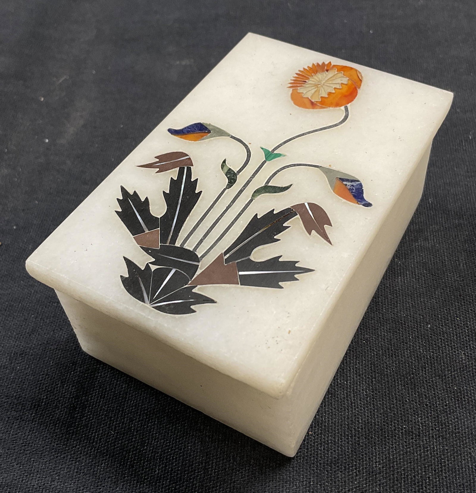 Inlaid Box w Carnelian, Lapis& Mother of Pearl: Inlaid Trinket Box W Carnelian, Lapiz & Mother of Pearl. Measures approx 3 x 2 inches. Floral detail with natural stone. Tested positive for natural stone, some surface wear consistent with age. Sligh