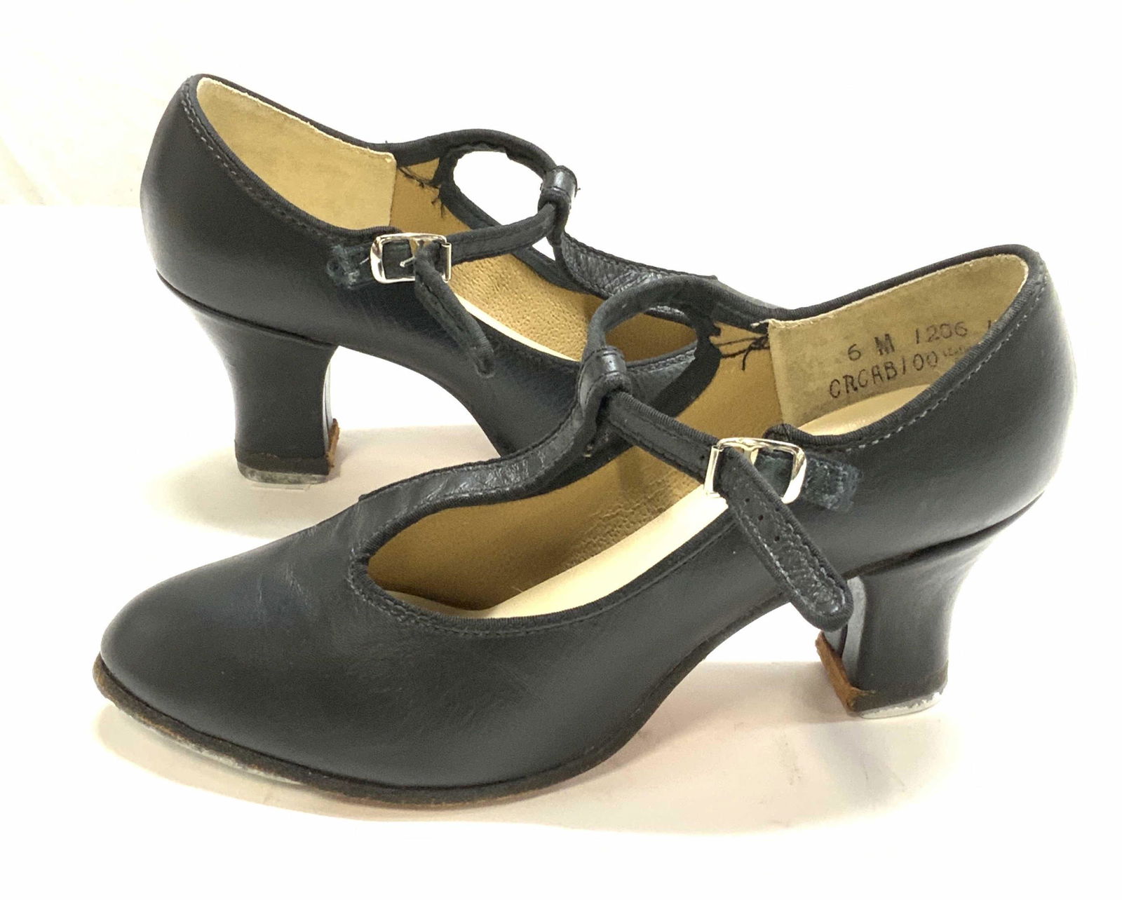 TAFFYS Black T Strap Heeled Leather Tap Shoes: Taffys black leather T strap heeled tap shoes. Size 6. 2.5 inch heel. Wear consistent with use. Metal taps to undersides. Taffys, taffys heels, ladies leather heels, ladies t strap heels, ladies tap s