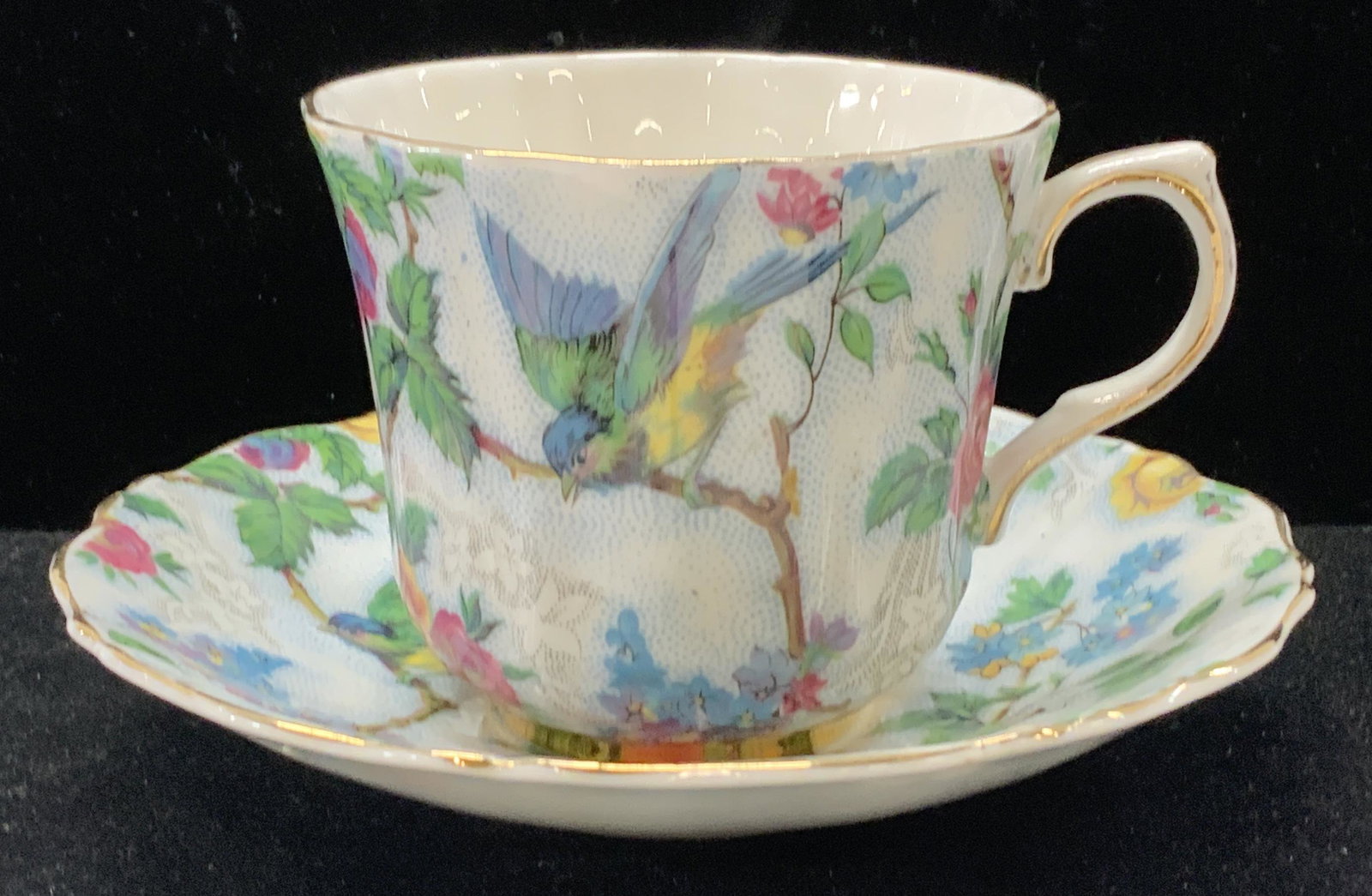 Old Royal Bone China Cup & Saucer, England: Fine bone English China cup and saucer, bright white with hand painted flowers and bird on a branch. Hallmarked Old Royal Bone China England. saucer measures 5.5 in. Cup measures 3 in ht, 4 in wide wi