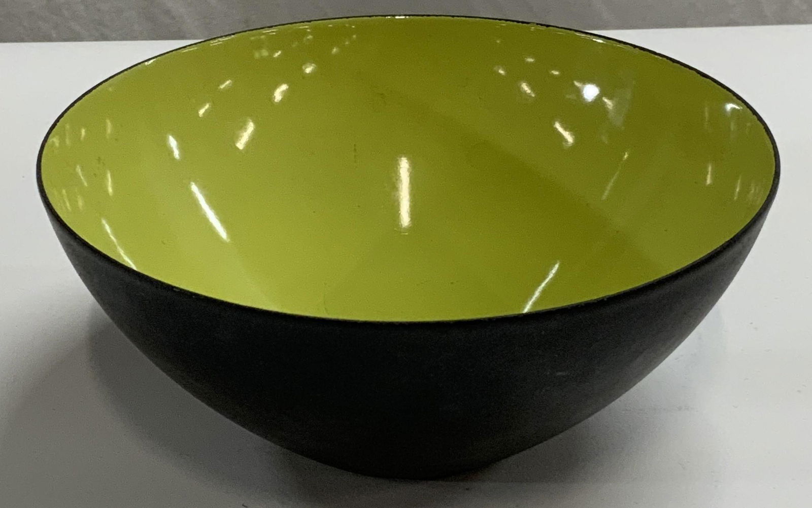 Vintage KRENIT Bowl by Herbert Krenchel, 1970s: Vintage circa 1970s KRENIT bowl by Herbert Krenchel. Black metal with green enamel. Measures approx. 6.25 inches diameter. Some surface wear consistent with exposure. Trademarked to underside. KRENIT,