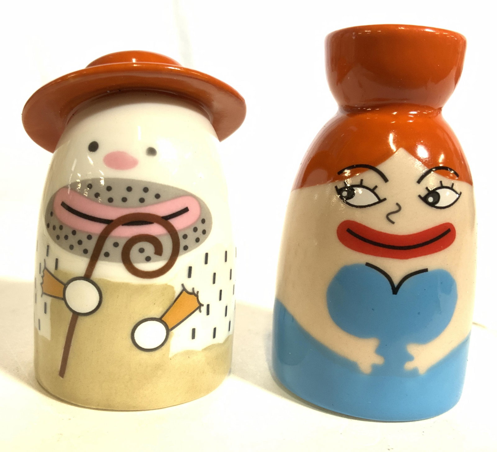 A DI ALESSI Porcelain LA SIGNORA ACQUA Figures IT: Underside of figures read A DI ALESSI. Figures are detailed to appear as a male & female figure. Pieces are porcelain. Figure includes box. Each Figure measures approx 2 inches tall 1.25 inches wide. 