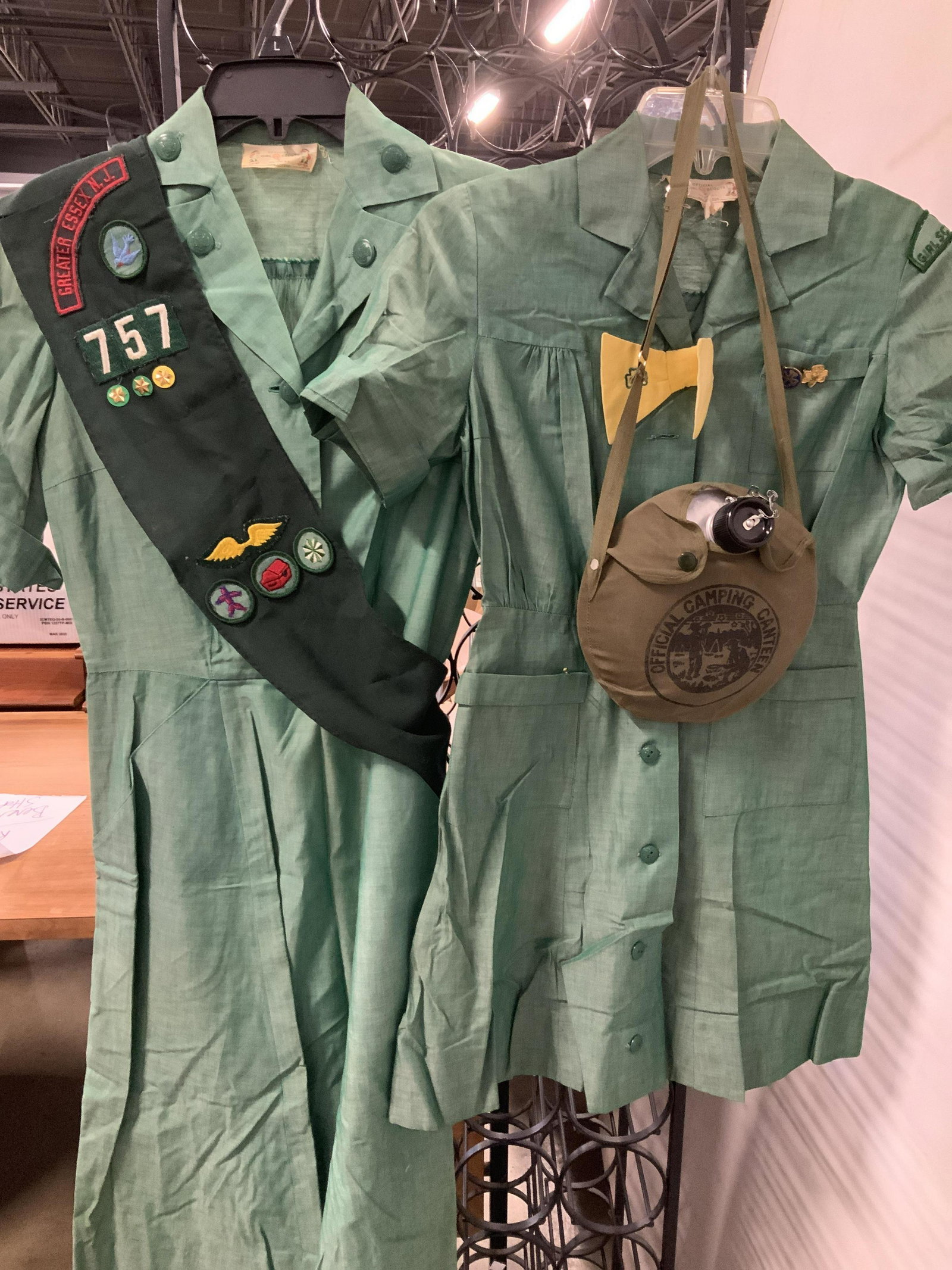 Collectible Girl Scout Clothing & Accessory Group: Lot includes vintage Girl Scout wearables- 2 official Girl Scout dresses 1 with with GS yellow Bow ( Sz 10 girls) and pins, the other with GS arm badge, Pins, yellow stripe on shoulders. Larger size d