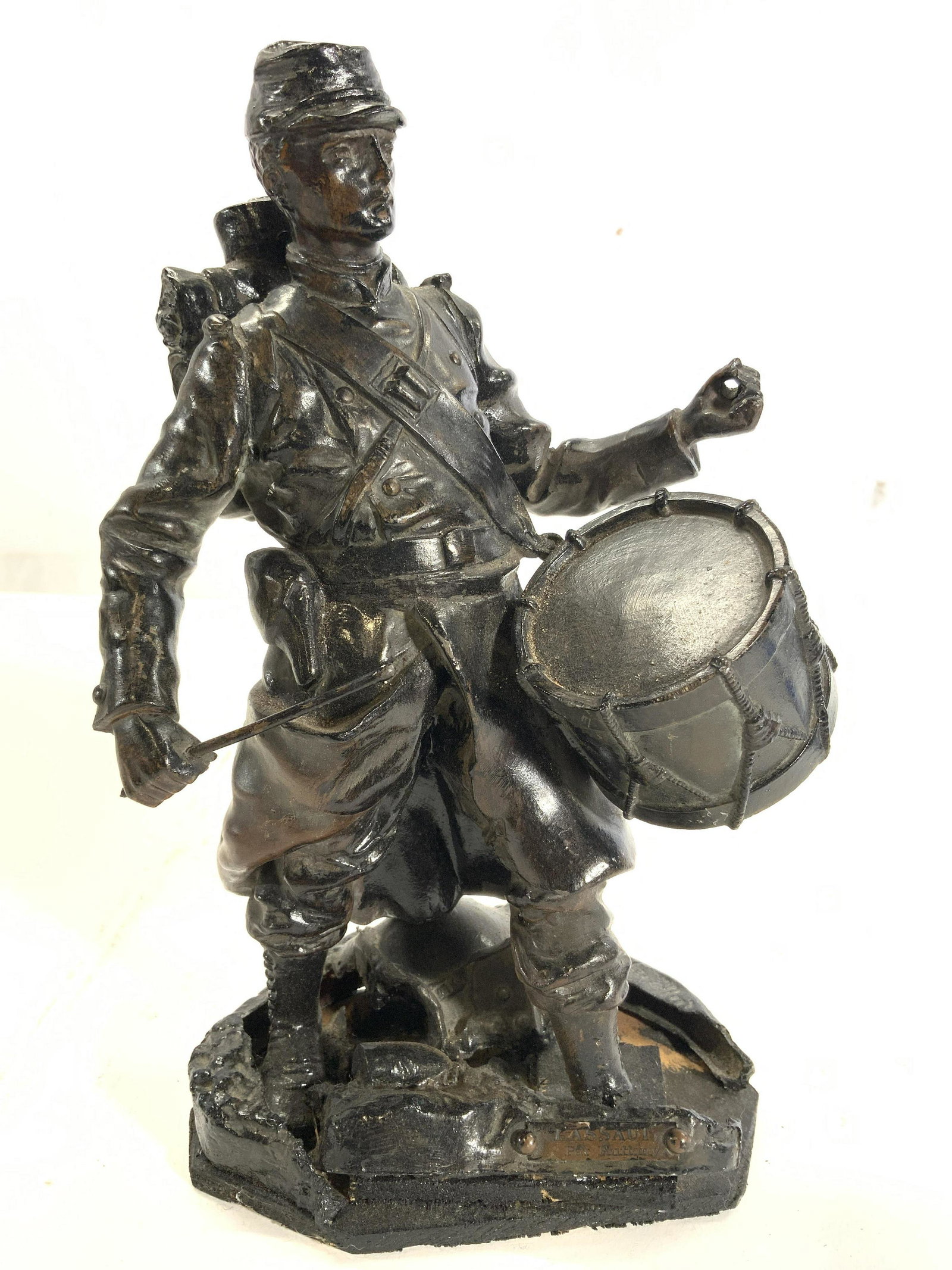 LASSAUI PAR RUFFONY Metal Drummer Sculpture: Sculpture is inscribed LASSAUI PAR RUFFONY. Piece depicts a male drummer figure. Piece is bronze toned and metal. Base appears to be wooden. Piece measures approx 10 inches tall 6 inches wide 4.5 inch