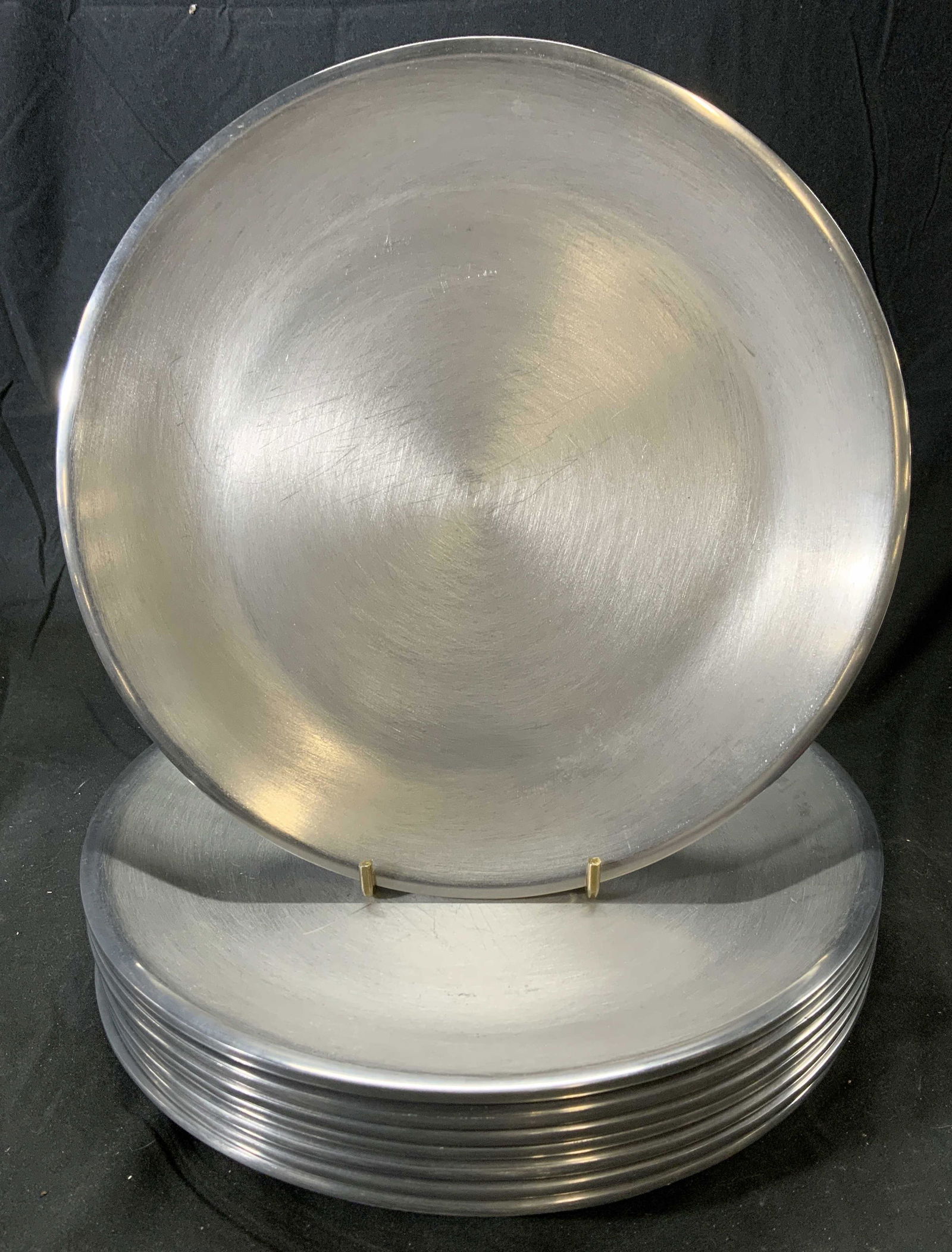 Set 8 Vintage Brushed Metal Dinner Plates: Set of 8 vintage brushed silver tone metal dinner plates. Measure approx. 10.25 inches diameter. Surface wear consistent with use and exposure. Plates are weighted. Dinner plate, plate set, dish set,