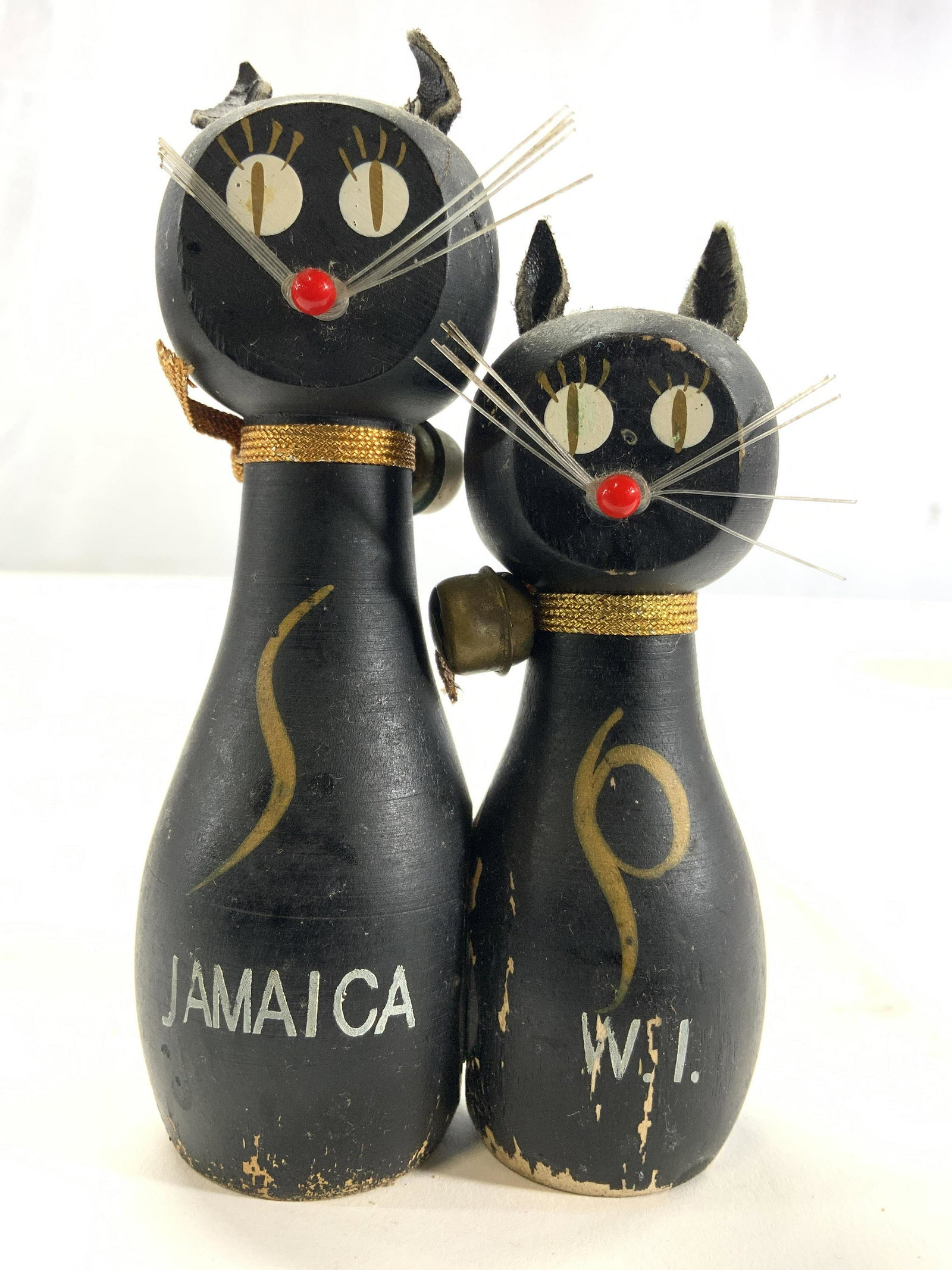 Cat Salt & Pepper Shakers: Lot includes 1 salt & 1 pepper shaker. Each are structured & designed to resemble cats. Shakers are black & gold toned. Each have whisker detail. Larger shaker measures approx 4.5 inches tall 1.35 inc