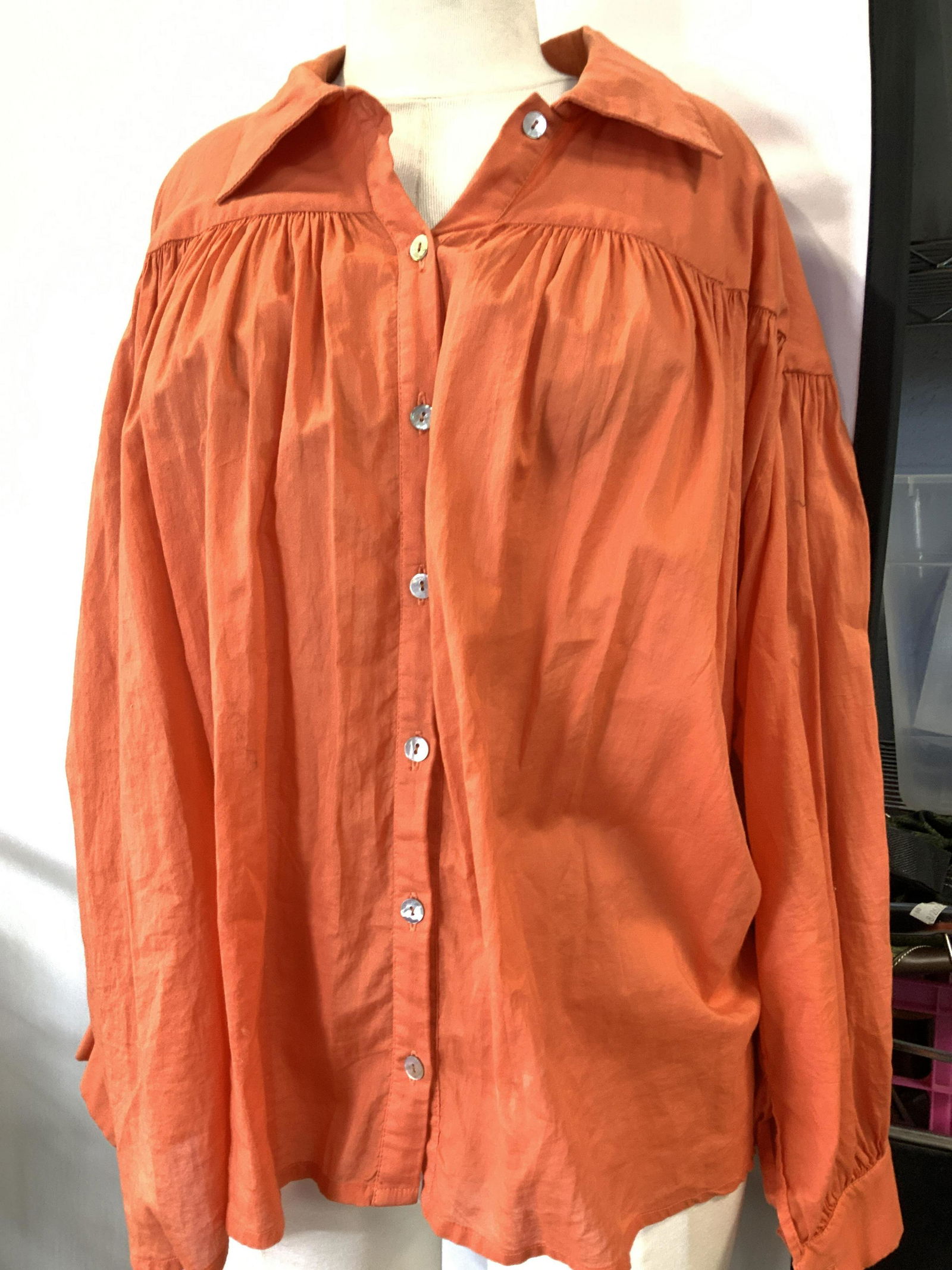 Lenny Niemeyer Light Cotton Blouse: Lightweight cotton blouse, long sleeves, button up, bright tropical orange in color. Front side with plisse design, designer label Lenny Niemeyer. Discoloration towed lower hem. Fits size large/ XL. P