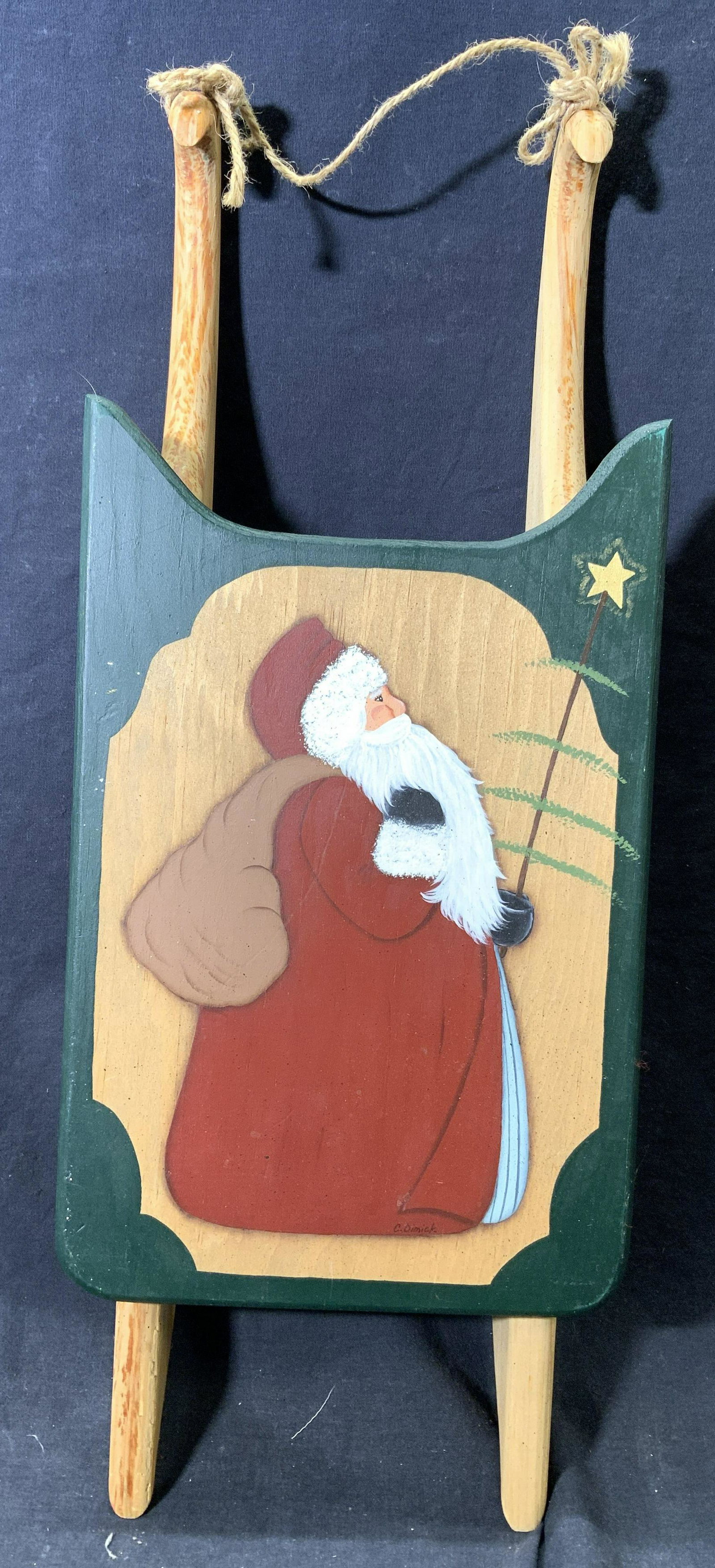 Vintage Wooden Santa Claus Sleigh Figure: Sleigh figure is vintage and wooden. Santa Claus figure is painted on top of piece. Piece appears to possibly be hand painted. 23 inches long 9 inches wide 3 inches tall. Sleigh, sleigh figure, Santa 