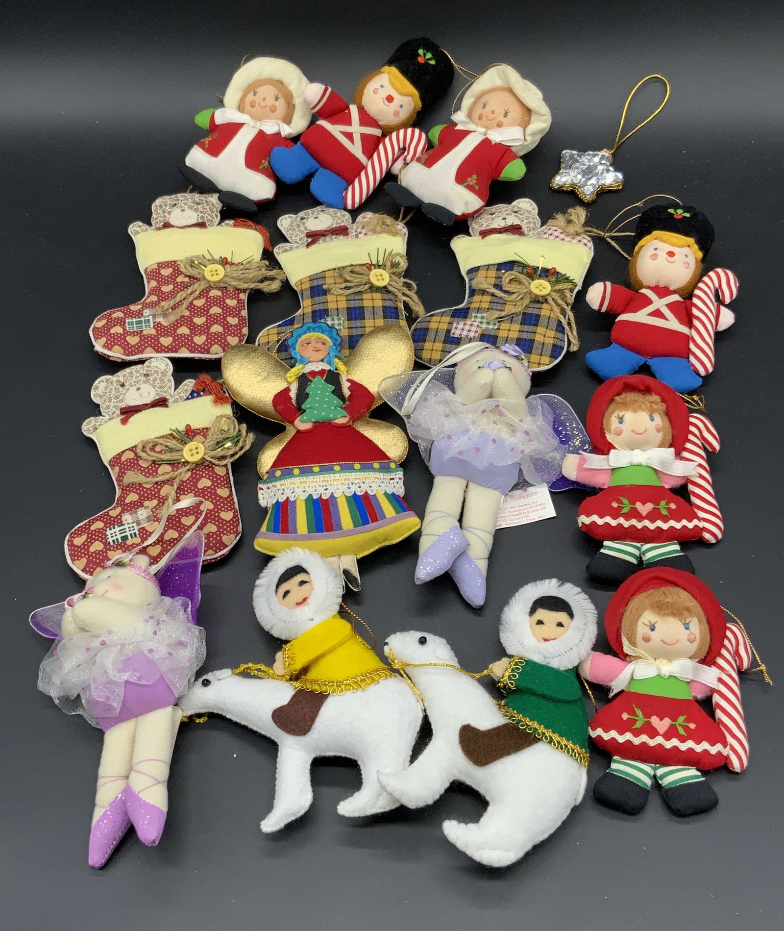 Lot 16 Vintage Holiday Ornaments, RUSS & More: Sixteen fabric holiday ornaments. Some vintage, some modern. Dolls are crafted from fabric materials. Ornaments include polar bears, people, bears, stockings, fairy bears, and more. Largest measures a