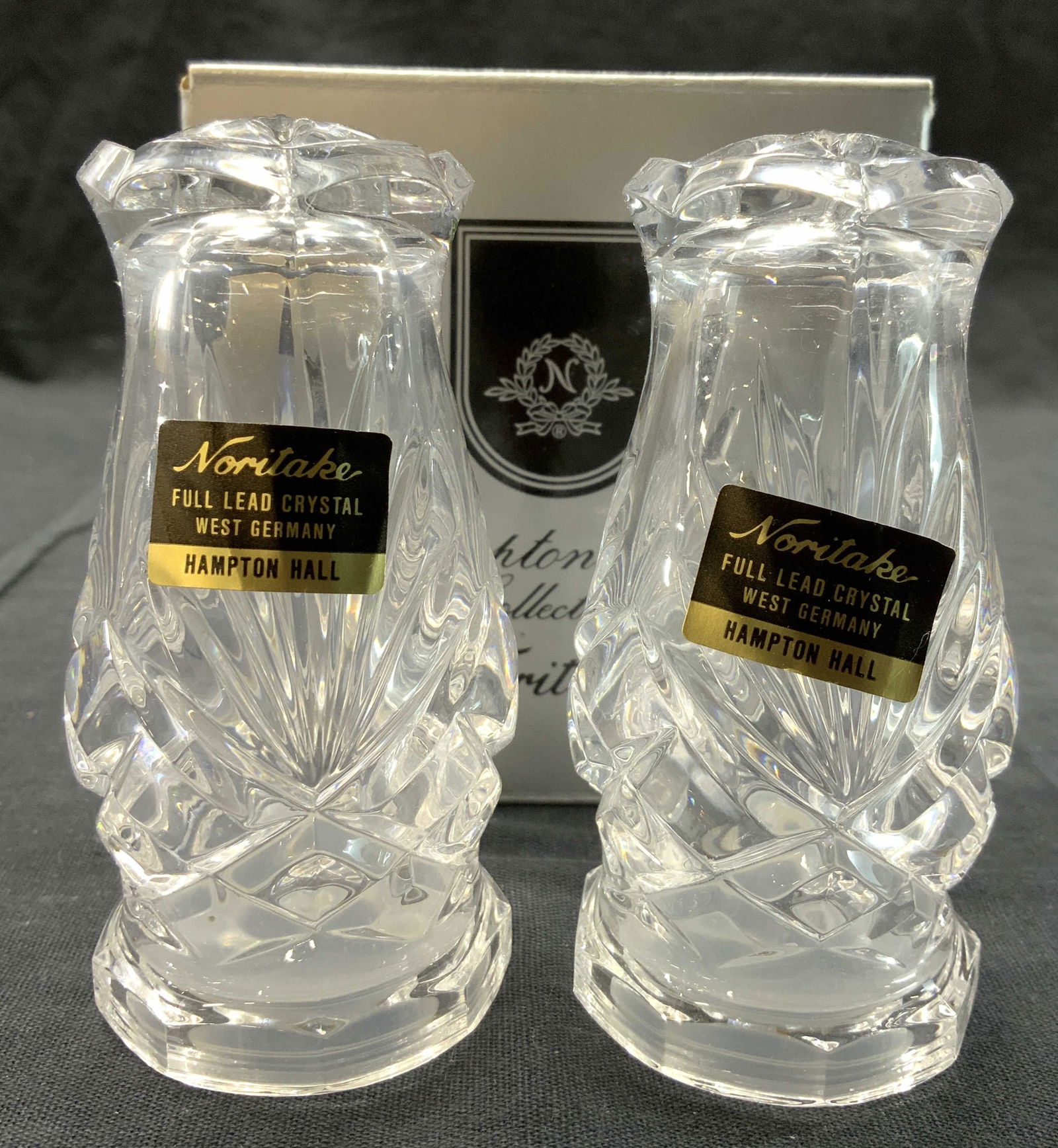 NORITAKE Crystal Salt & Pepper Shakers In Box: Lot includes 1 salt & 1 pepper shaker. Each are crystal as reads on tag. Lot includes box which reads NORITAKE HAMPTON HALL COLLECTION. Each shaker measures approx 3.5 inches tall 2 inches wide. Salt
