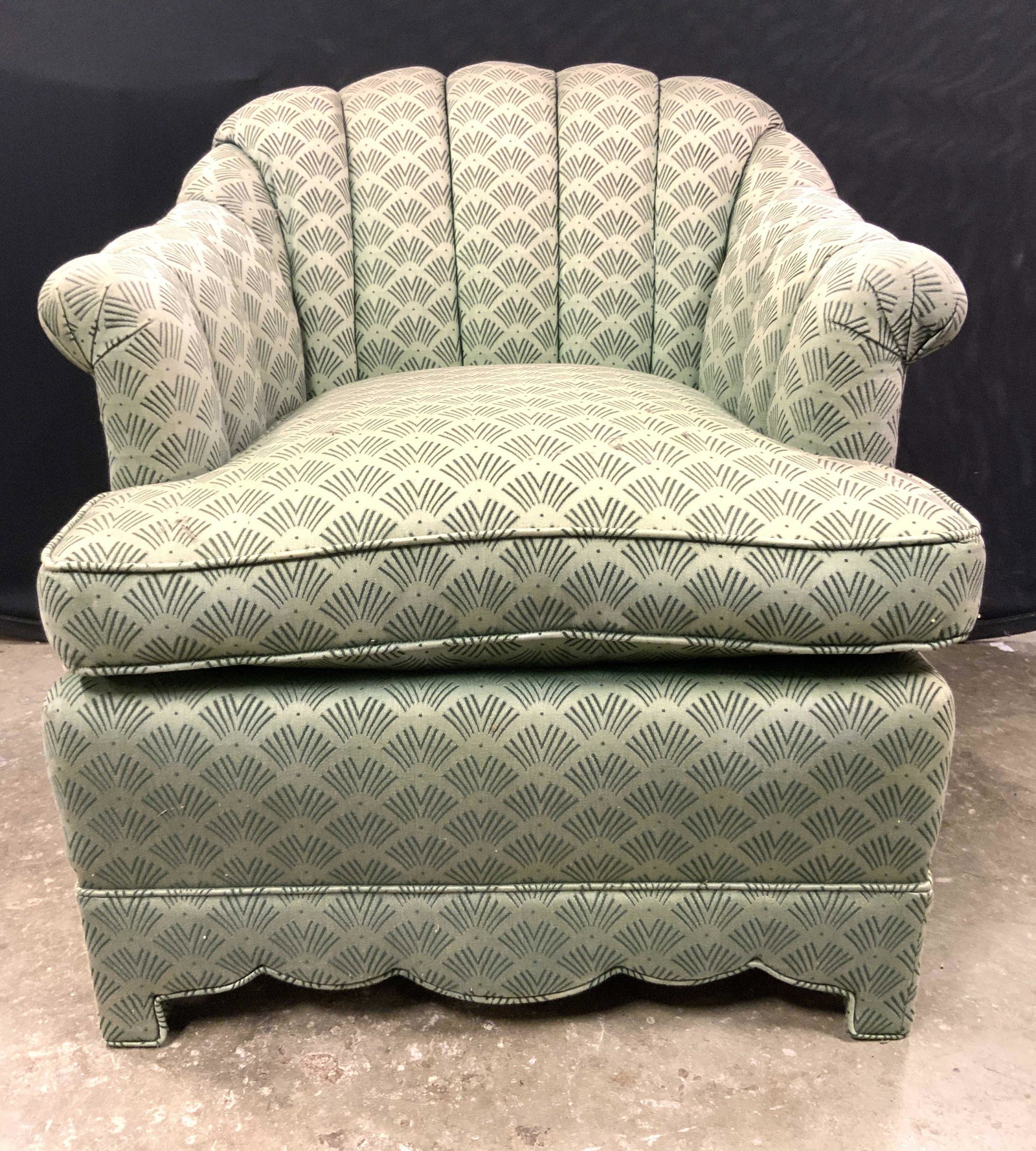 Vintage Upholstered Armchair In Green: Armchair is vintage. Upholstery is green toned with patterned detail. Chair is footed piece measures approx 31 inches tall 27 inches wide 34 inches deep. Chair, vintage chair, armchair, upholstered ar