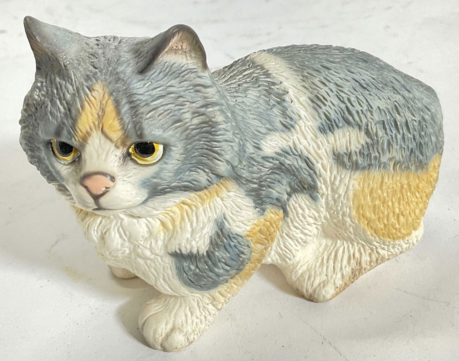 GOEBEL Porcelain Cat Figural: GOEBEL porcelain cat figural. Marked at bottom. Measures approx 4W x 3.25H inches. No visible wear to piece. Goebel Porzellanfabrik. Goebel acquired rights to turn Hummel's drawing into figurines, pro