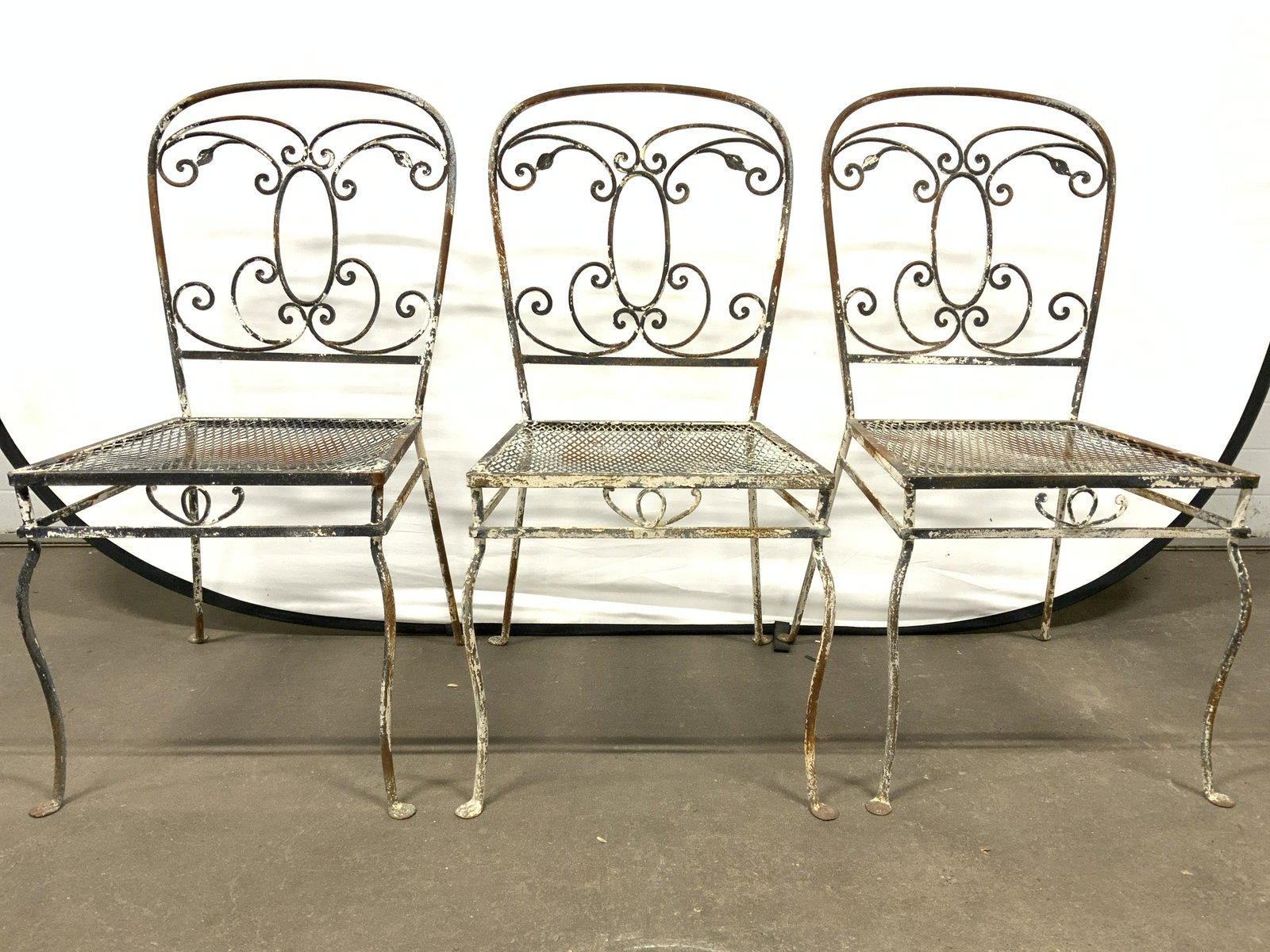 Antique Iron Outdoor Patio Chairs: Patio chairs are vintage Possibly antique. Each chair is iron. Backrests have c curve structures in addition to leaf structures. Patio chairs, patio furniture, homewares, home furnishings, iron chairs