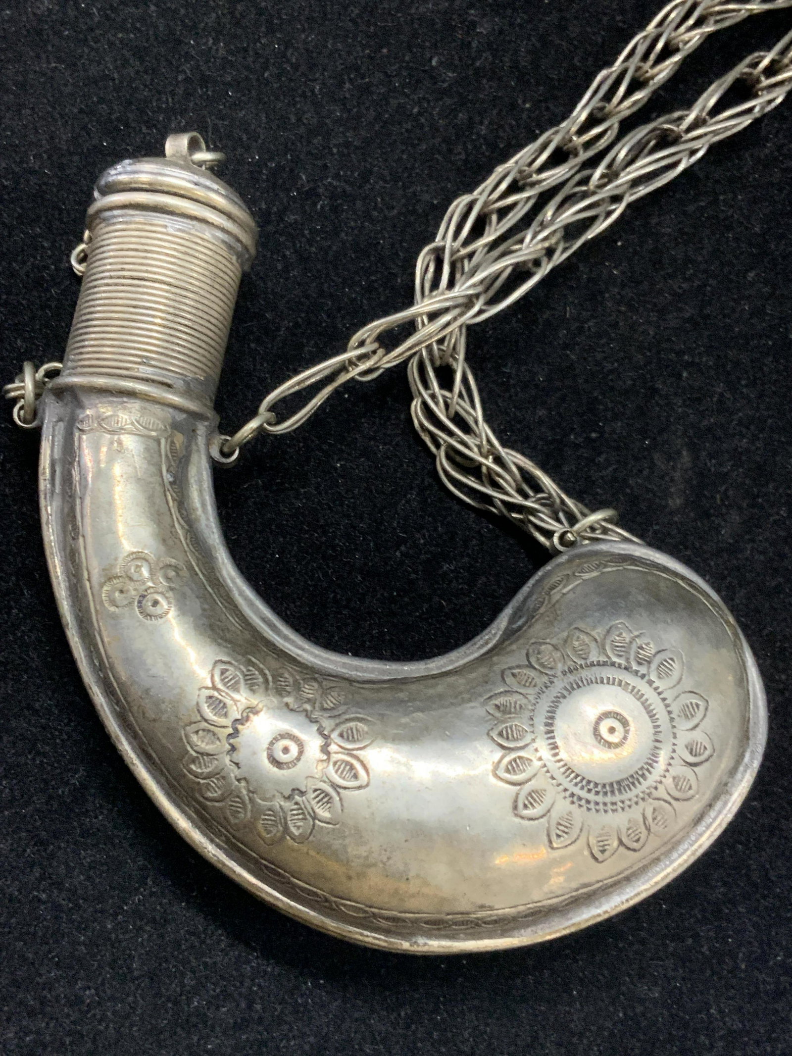 Vintage Etched Gun Powder Necklace/ Snuff Bottle: Vintage etched gun powder bottle necklace/ snuff bottle. Arched in shape with scrolled etchings on either side. Approximately 19 inches long. Evident wearing to bottle and chain. Cap is unable to deta