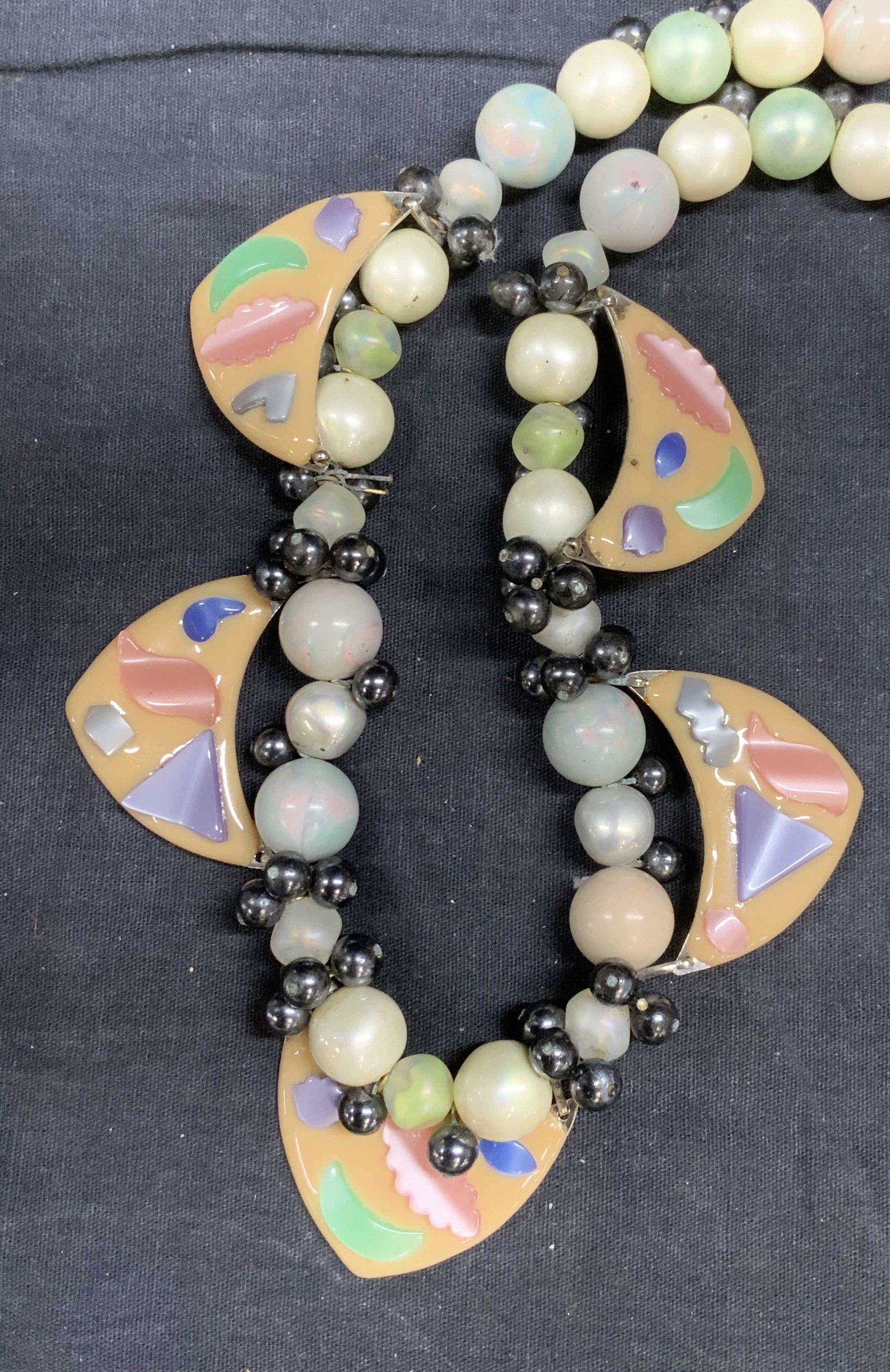 Olympia Gibson Hand Wired Chunky Necklace: Chunky multi colored costume Pearl necklace wired with bunches of gunmetal toned beads and whimsical jewelry resin accents. Signed on charm Olympia Gibson. 16 in. Long. 2 in wide. 3 Luxury Statement j