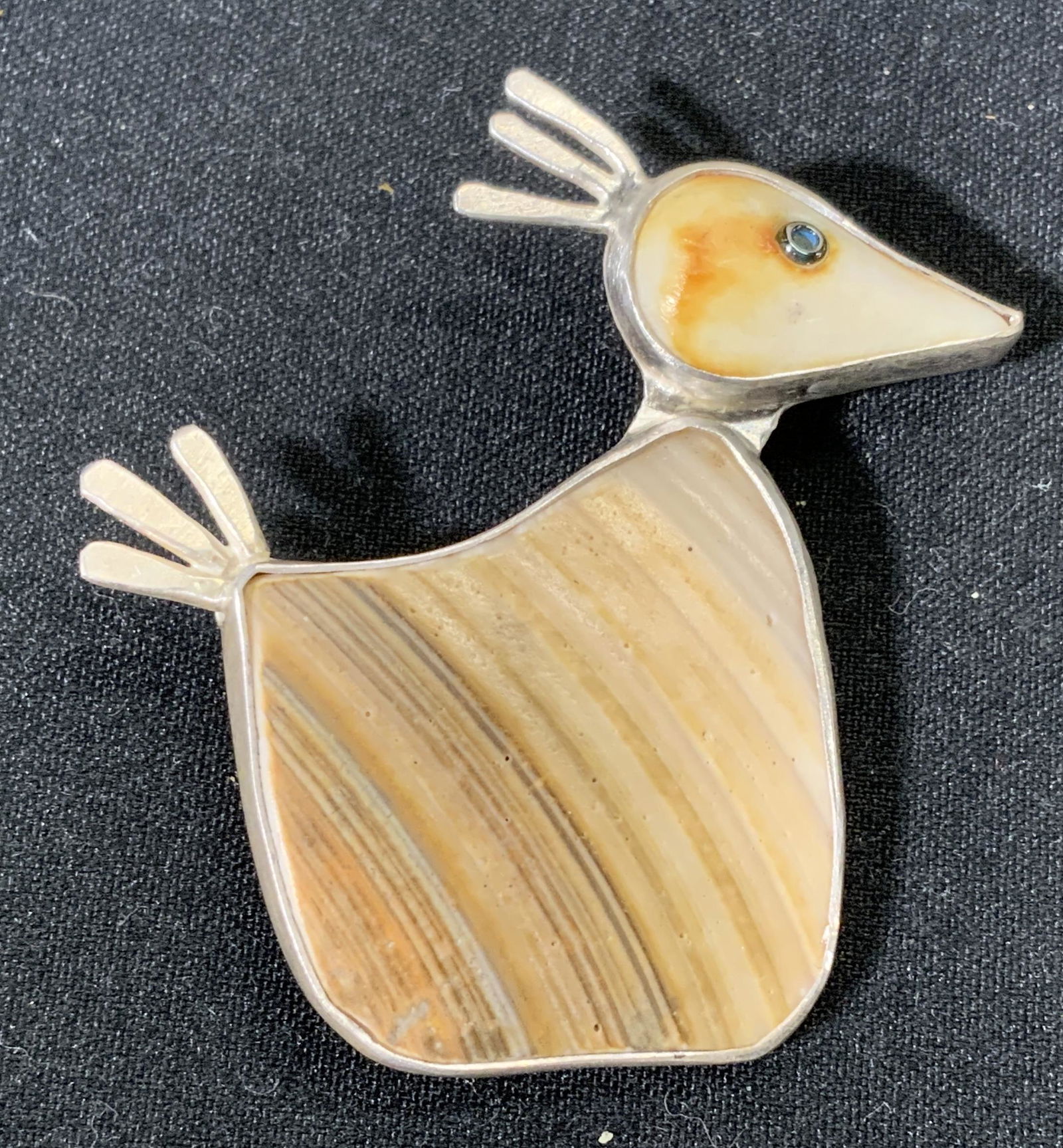 LETERNEAU Sterling Silver&Bone Bird Brooch: JAMES LETERNEAU signed sterling silver bird form brooch with bezel set hand carved bone. Signature stamped to underside, marked sterling. Hinge pin pin and catch fastener. In good condition. Measures