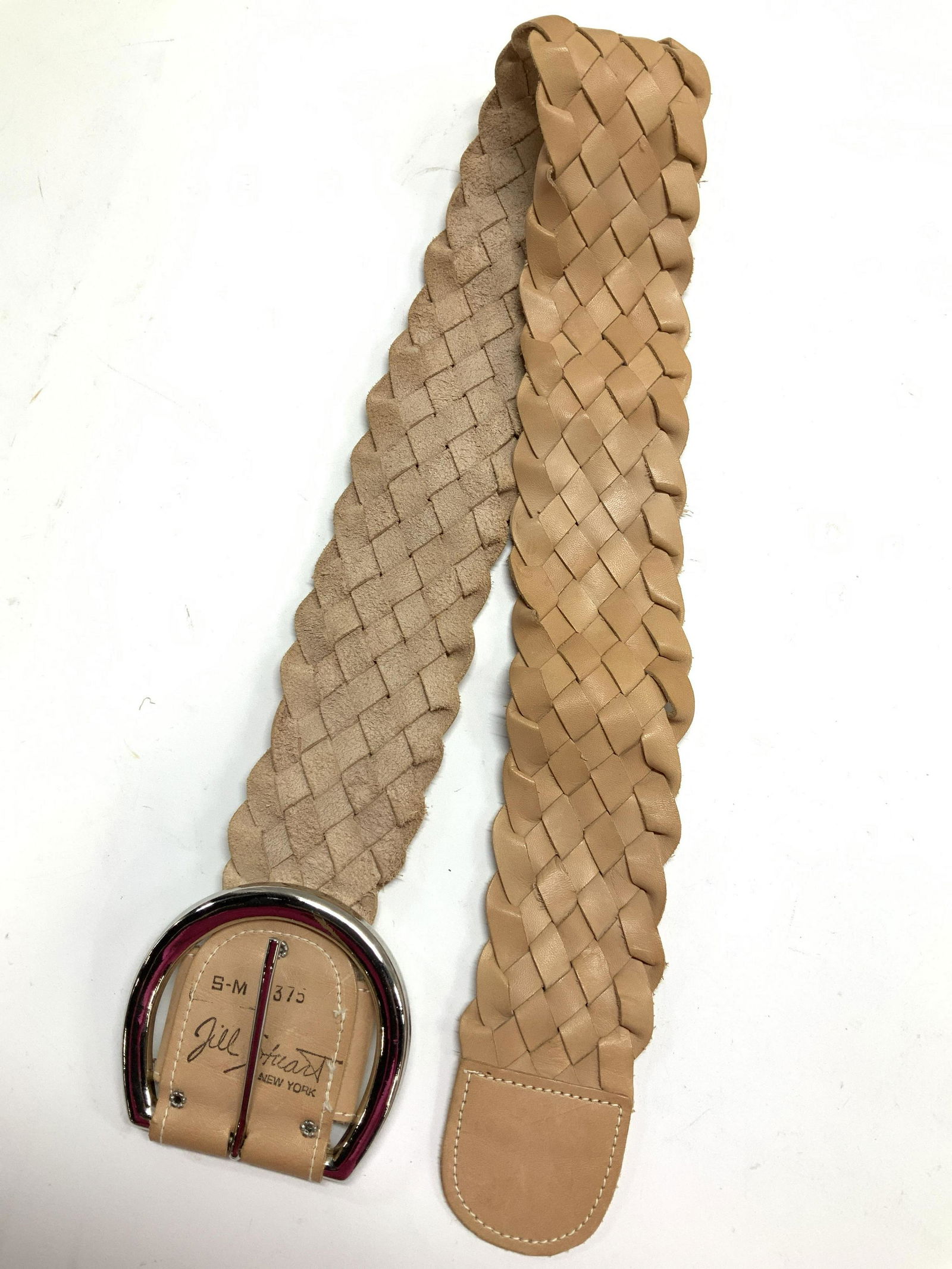 Jill Stuart Wide Braided Braided Leather Belt, New: Jill Stuart New York Signed Luxury Braided tan leather belt with silver tone heavy buckle in shape of horseshoe. Size Small- Medium. 39 in. Total length, length with prong 36 in. 2.5 in wide. Property