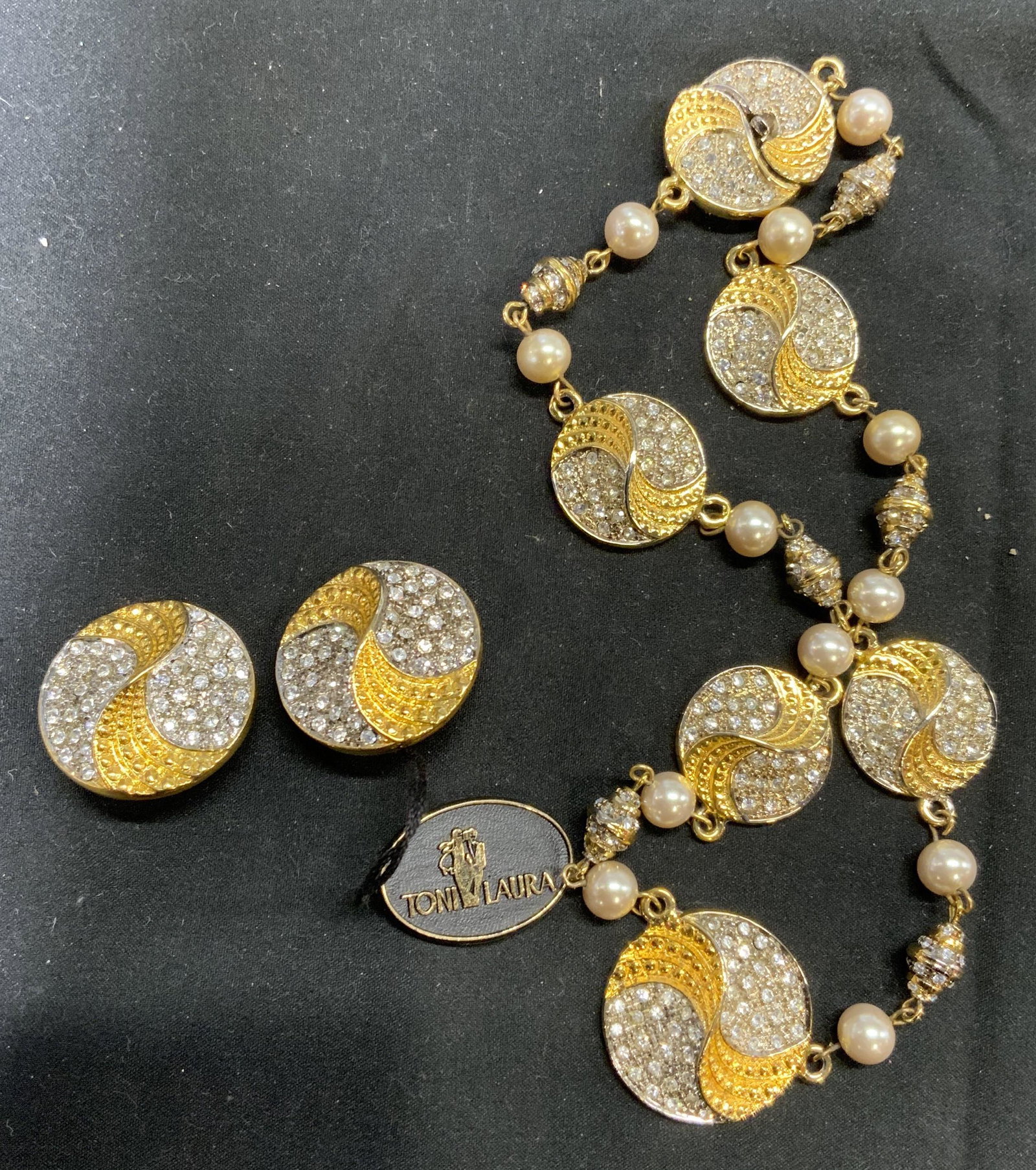 Set TONI LAURA Gold Tone Crystal Choker & Earrings: Set of vintage TONI LAURA gold tone clip on earrings with faceted colorless crystals and gold tone choker necklace with faux Pearl beads and faceted colorless crystals, box clasp. Earrings measure app