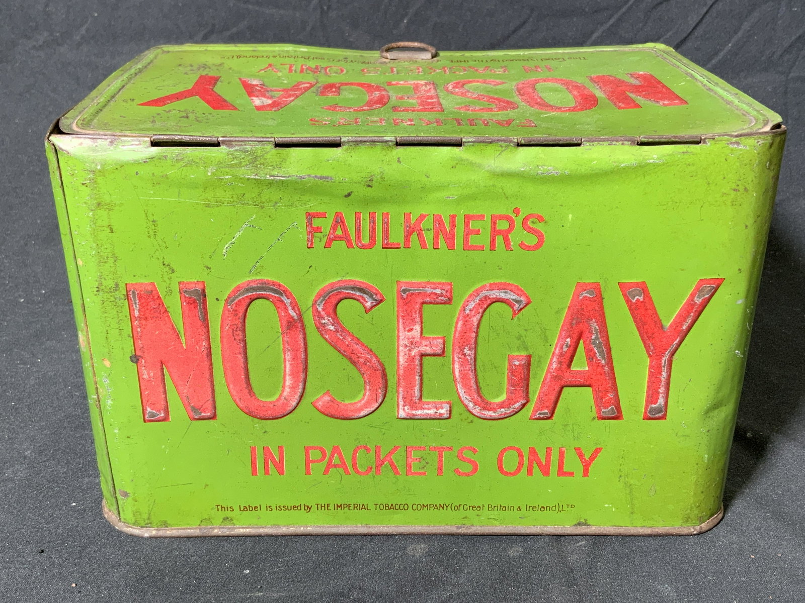 Antique Faulkners Nosegay Tobacco Advertising Tin: Antique Faulkners Nosegay Virginia tobacco advertising tin. Trademarked to tin. Issued by The Imperial Tobacco Company of Grey Britain and Ireland. Measures approx. 8.75 x 5.75 x 5.5 inches. Surface w