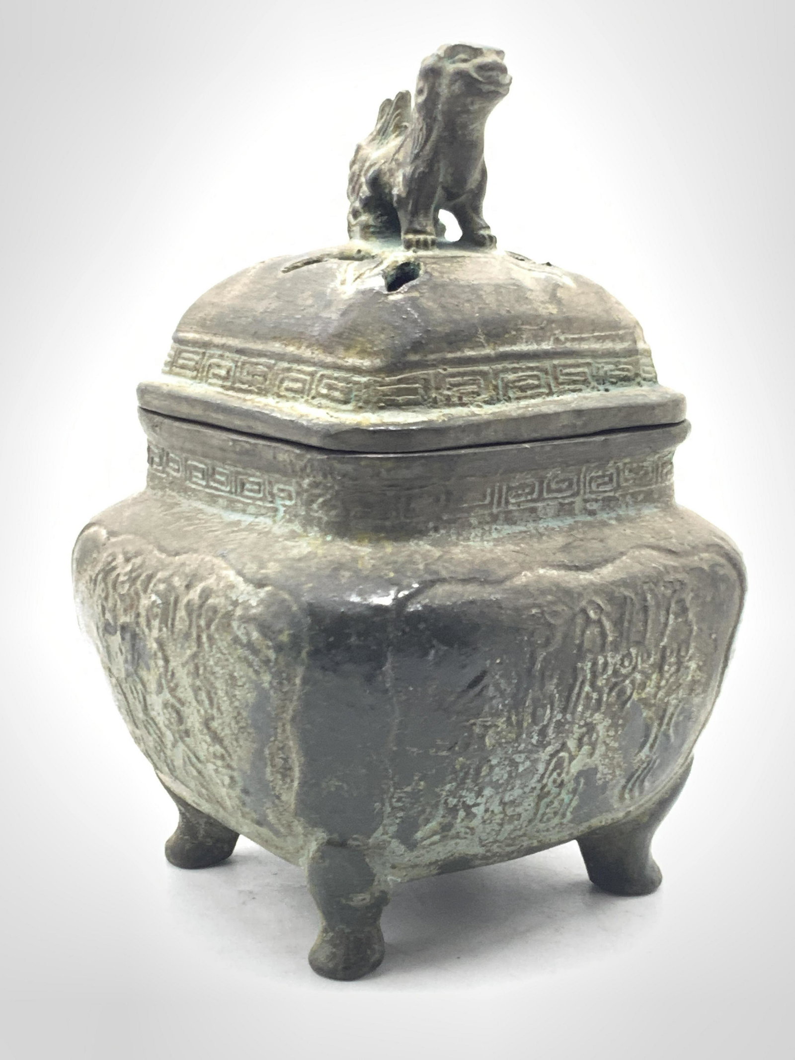 Vintage Asian Foo Dog Iron Incenser: Vintage Asian incenser, crafted from iron with the lid adorn with a foo dog sculpture. Cut outs in the lid allow incense smoke to come through. Body of incenser is square in shape with bottom feet. Bo