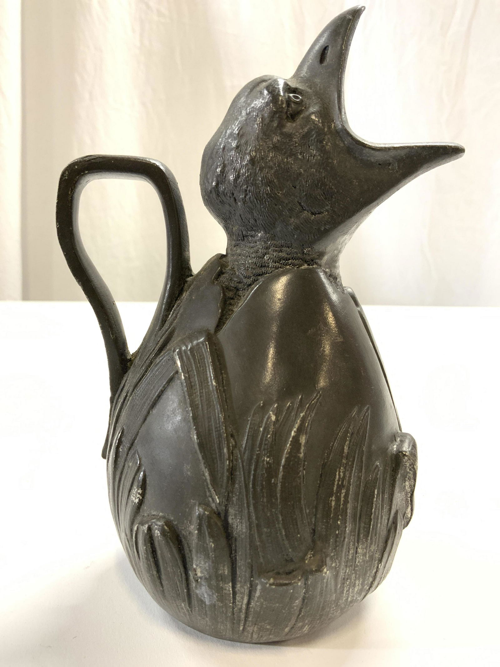 JEAN GARNIER Antq Art Nouveau Pewter Chick Pitcher: Pitcher is signed J GARNIER, underside is inscribed ETAIN GARANTITO PUR PARIS. Pitcher is pewter. Depicts a baby bird with mouth agape. Pitcher is antique circa 1900-1909. Piece is art nouveau style.