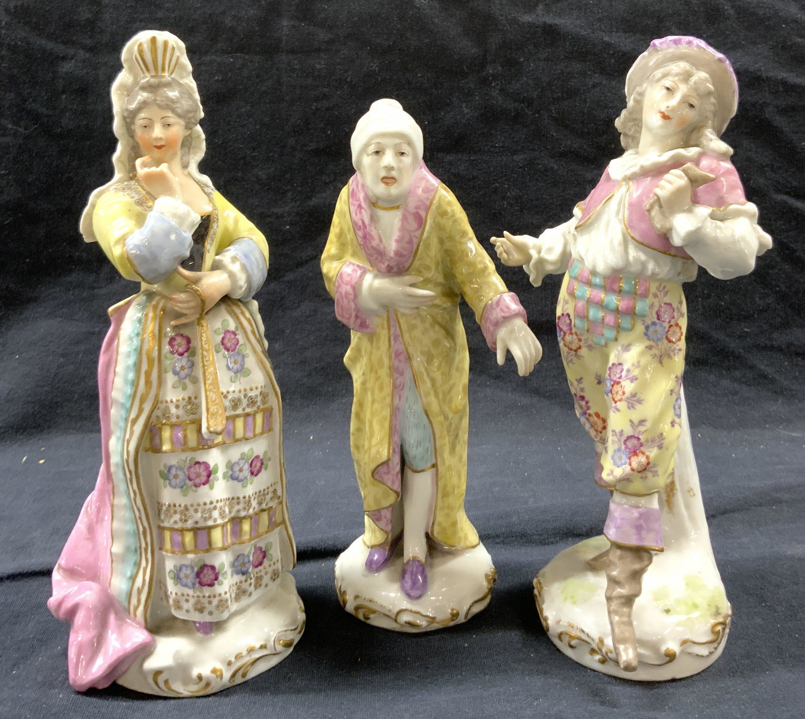 Lot 3 MEISSEN Vintage Porcelain Female Figures: Lot includes 3 porcelain figurines. Each have MEISSEN crossing sword trademark. Each figurine depicts a female figure. Largest figure measures approximately 7 inches tall 3.5 inches wide 3 inches deep