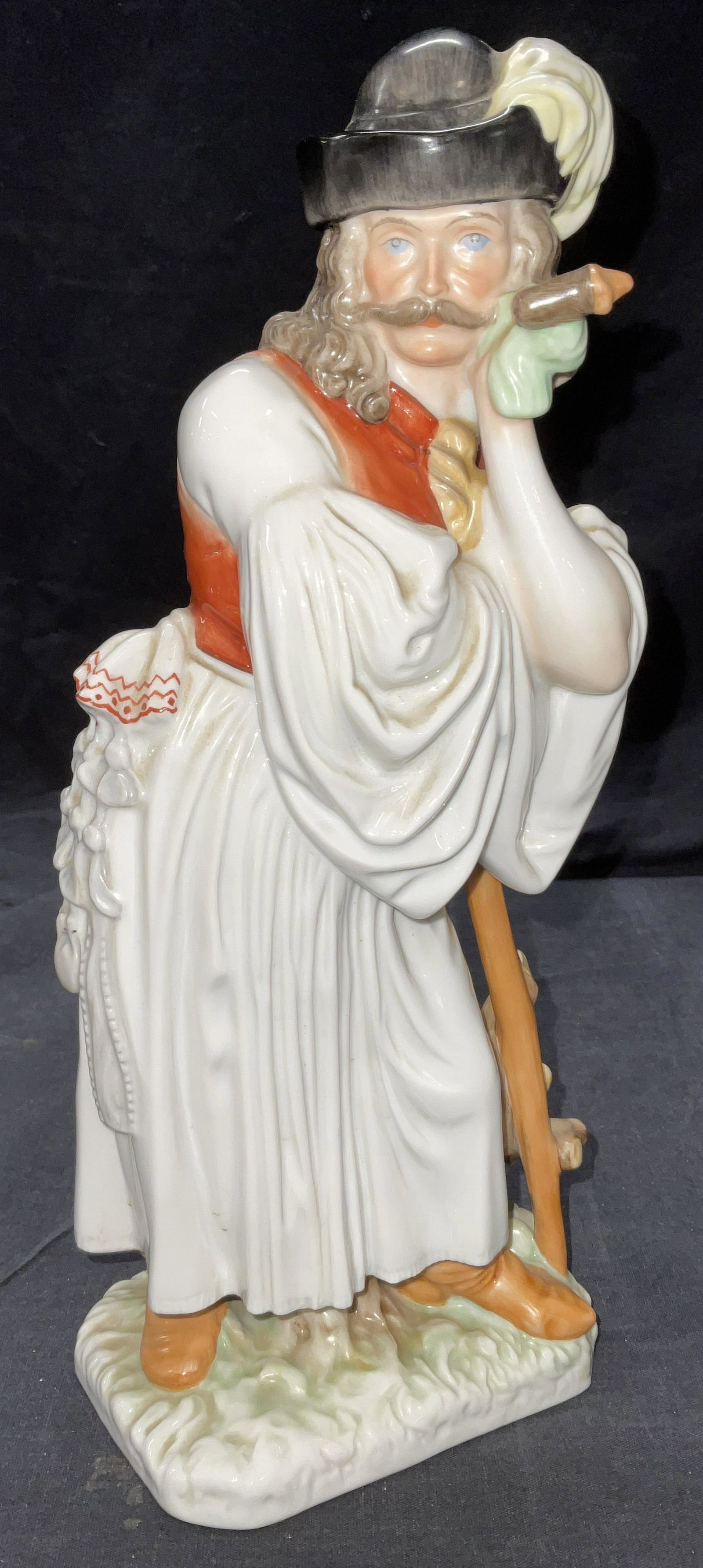 HEREND Porcelain Figure of Gentleman.: Original Herend Hungary shepherd glazed porcelain statue. Shepherd wearing traditional Hungarian clothes, hat with feather and holding shepherd's stick, blue Herend stamp on the bottom. The bottom is 