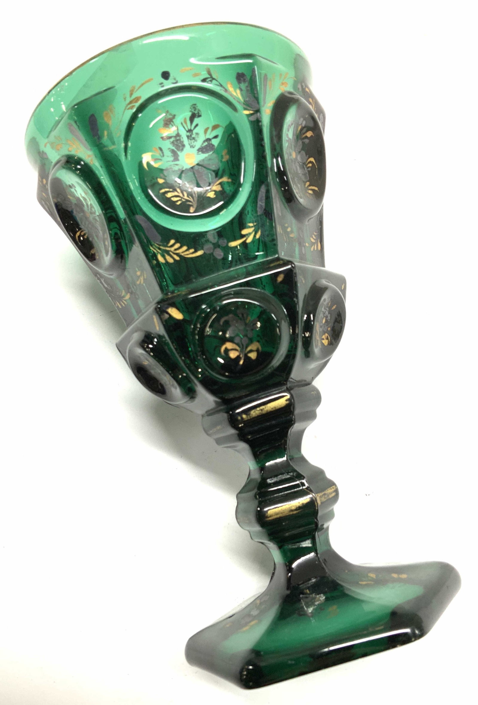 Thick Walled Emerald Green Glass Chalice: Vintage Bohemian Style Emerald Green Footed Glass Chalice, 6.5 x 3.75 in. Worn Gilt . Hexagonal base and faceted sides with circle designs. 3 Emerald Green Glass, Kitchenlia, Bohemian Style Colored gl