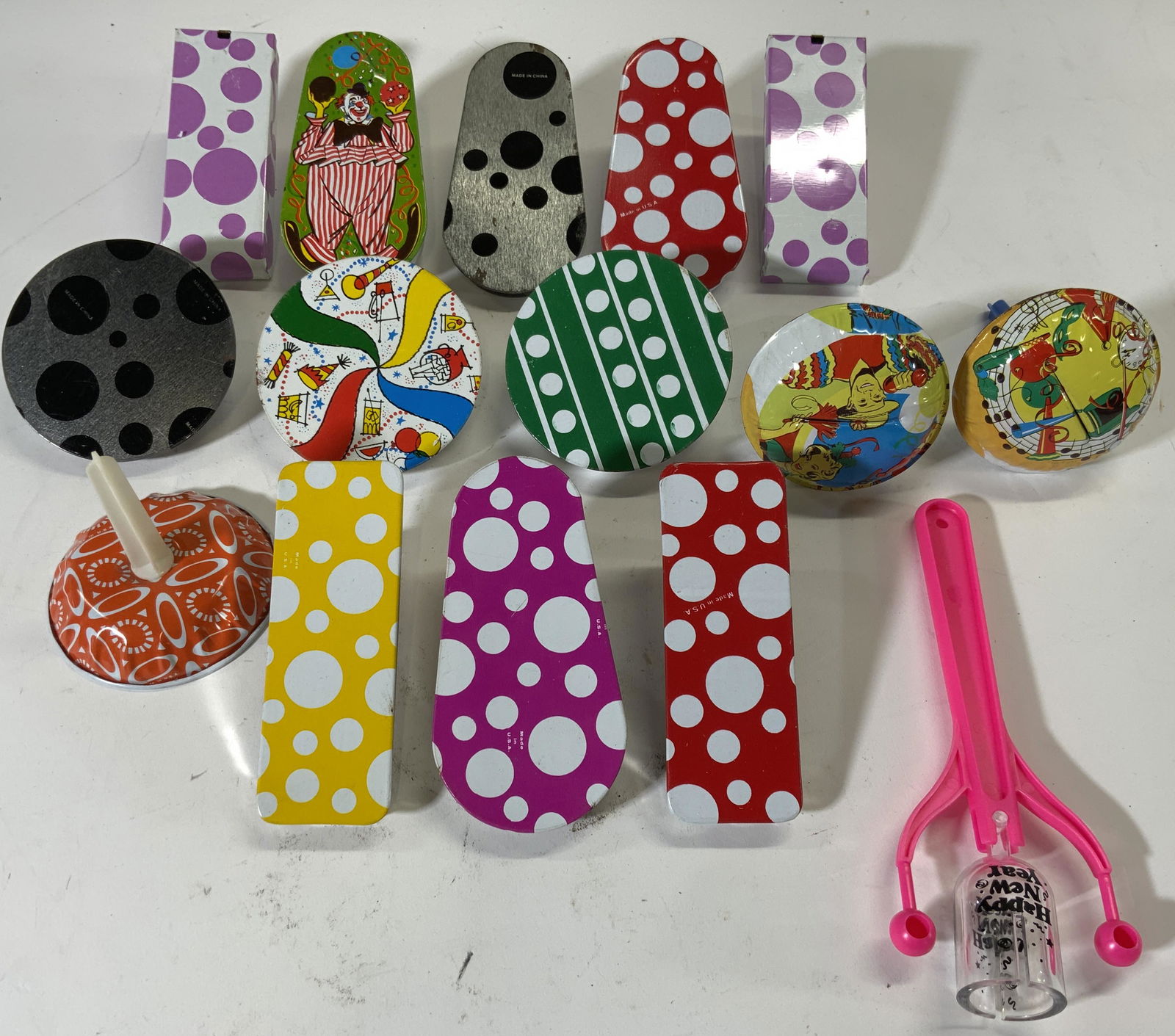 Lot 15 Vintage Toys Noisemakers: Lot includes 15 noisemakers. Includes spinning noisemakers, bells & striker with pink handle. Striker measures approx 7.25 inches long 3 inches wide. Noisemakers, toys, toy noisemakers, New Years Nois