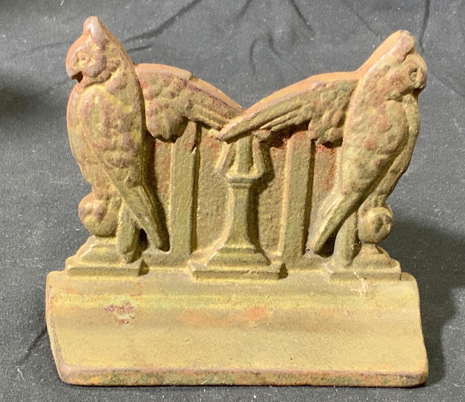 Vintage Iron Owl Bookend: Vintage iron booken with embossed owl motif. Measures approx. 4.25 x 1.75 x 3.5 inches. Piece is weighted. Wear to surface consistent with exposure. Bookend, iron bookend owl bookend, owl decor, table