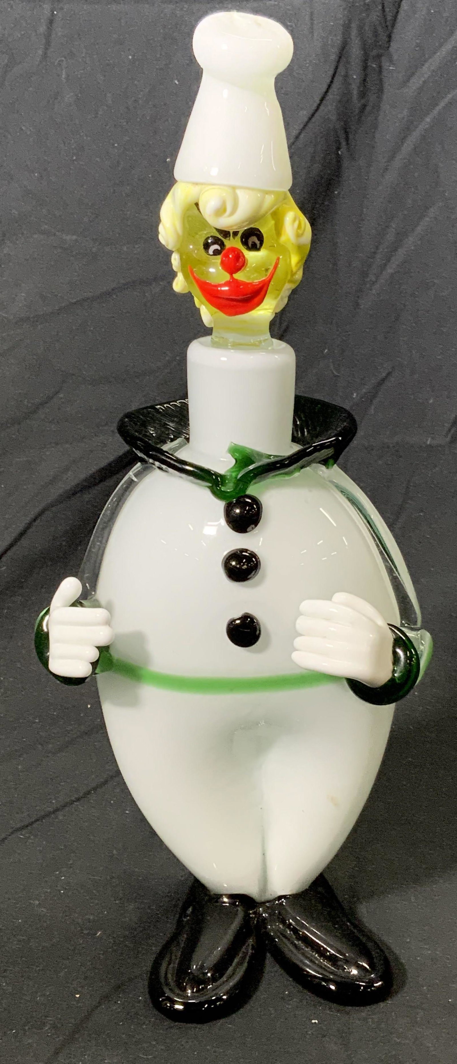 Vtg MURANO Style Art Glass Clown Decanter: A vintage MURANO style art glass clown form decanter in hues of white, green, yellow, and red. In good condition. Measures approx. 5.5 x 4.5 x 12.25 inches. Art glass, clown, glass clown, clown decant