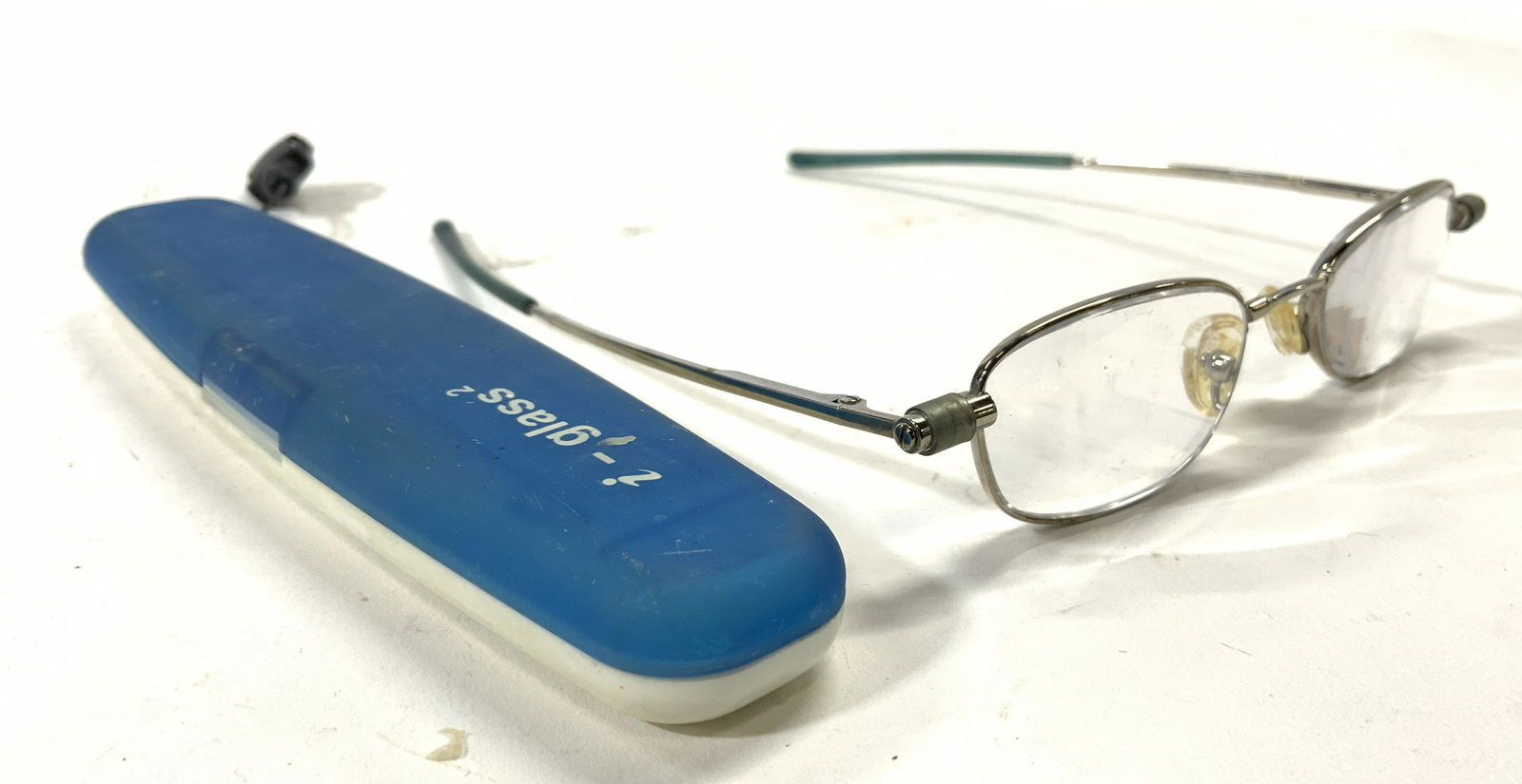 Pair I GLASS Eyeglasses W Case: Glasses and case reads I GLASS. Glasses have metal frames. measures approx 5.25 inches wide 5.5 inches deep. Glasses, metal frame glasses, glass and case, eyeglasses, I Glass. 6
