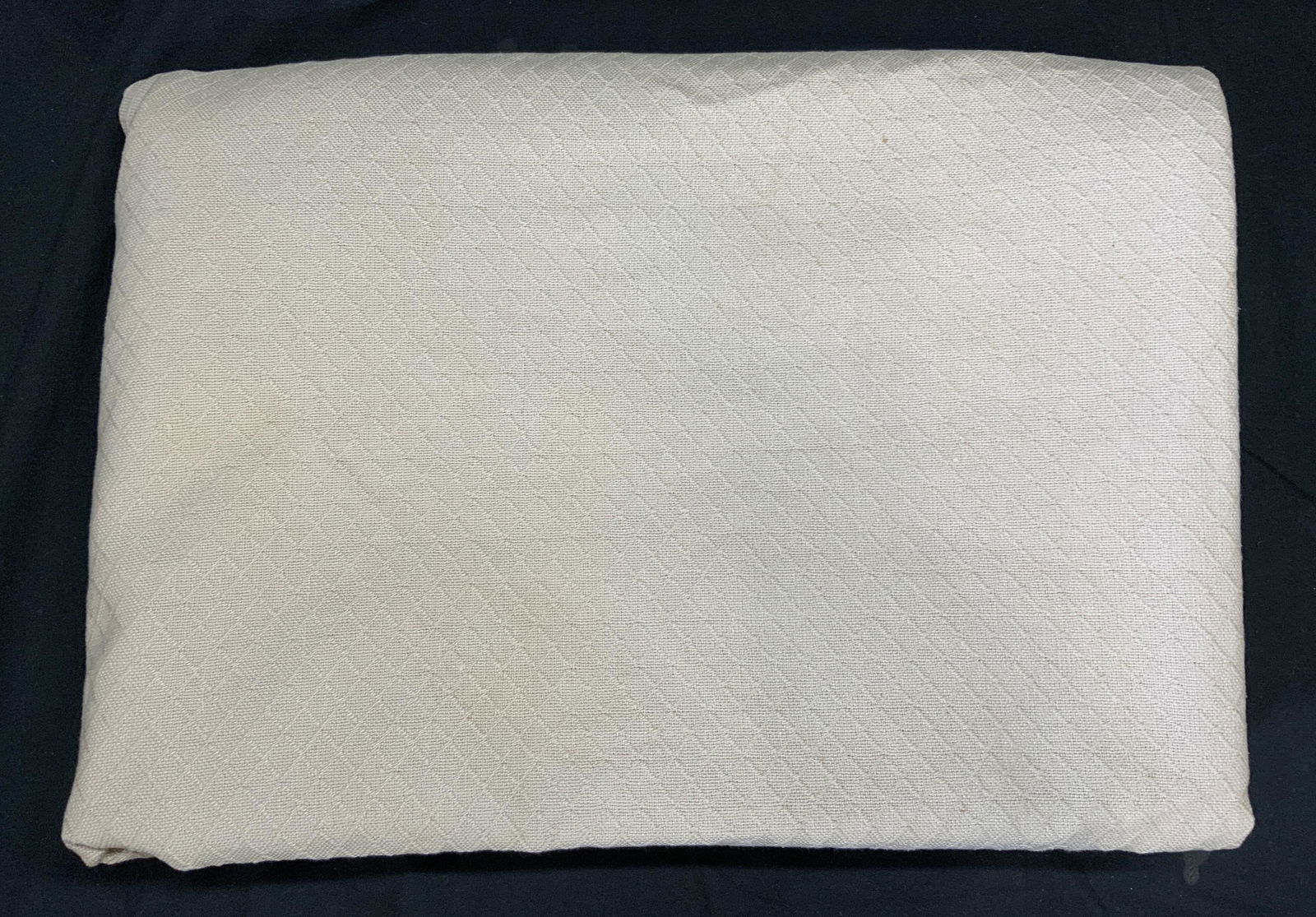 Beige Diamond Pattern Table Linen: A beige table linen with embroidered diamond pattern. Heavy weight fabric, feels like cotton. Blemishes to fabric present, needs cleaning. Measures approx. 80 x 110 inches. Table linen, tablecloth, be