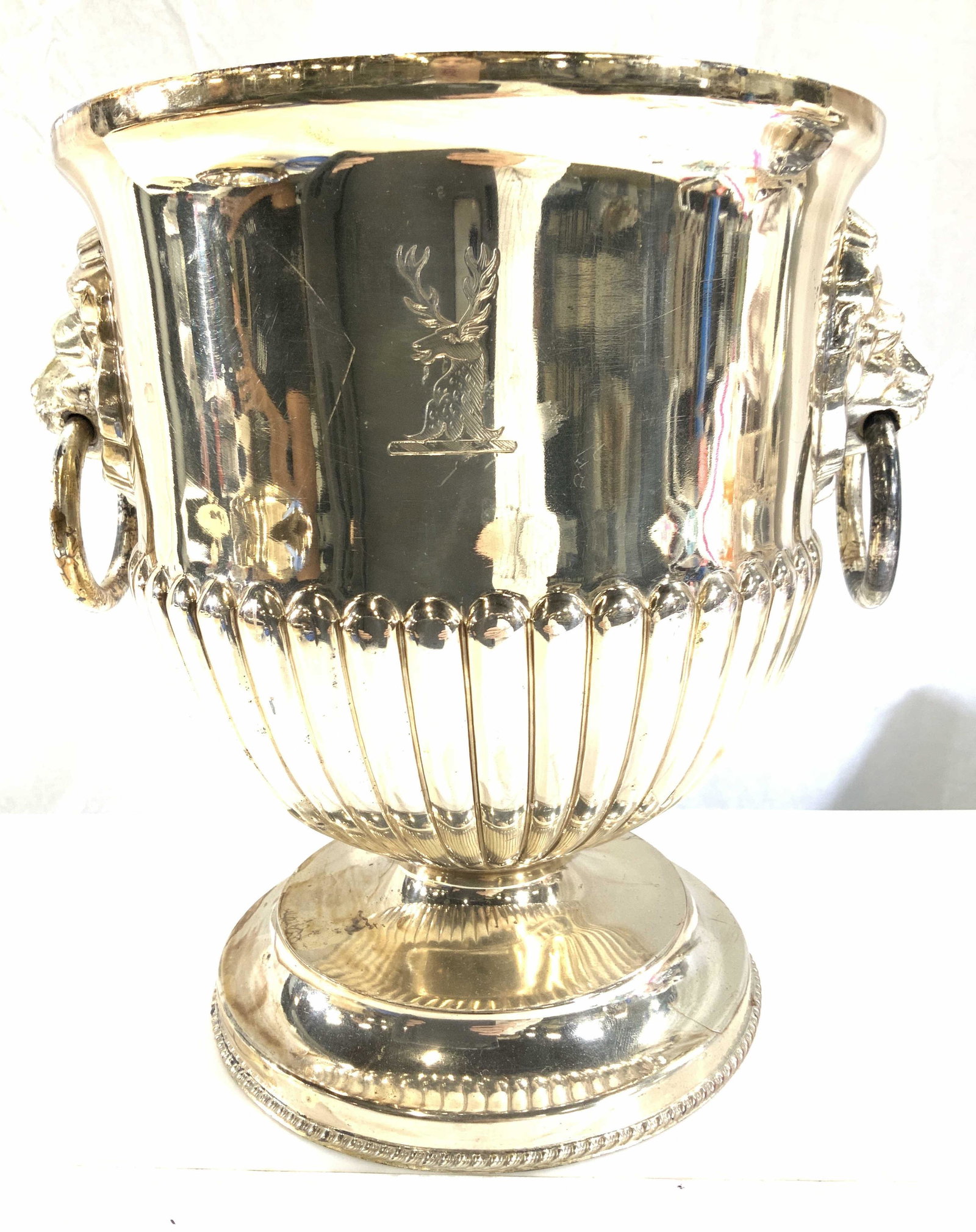 Heavy Silver Tn Champagne Bucket w Lion Rings, 2: Silver Footed Urn Style Champagne bucket with neoclassical elements. Lion head rings on each side and etched stag on bucket. Interior cylinder that is removable, ice is placed around cylinder to cook 