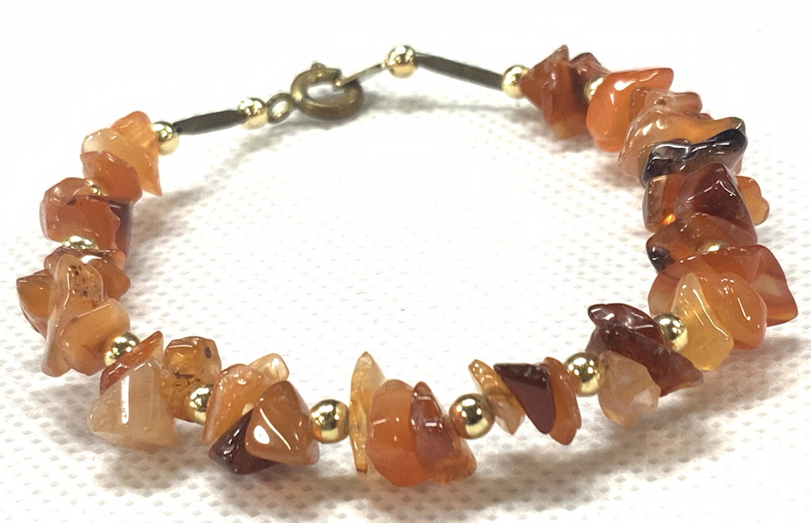 Arts & Crafts Carnelian Chip Beaded Bracelet: Artisan crafted breaded bracelet made with carnelian chips. Approximately 2.5 inches in diameter. Arts and crafts bracelet, crafted jewelry, natural stone chip bracelet, stone chip bracelet, carnelIan