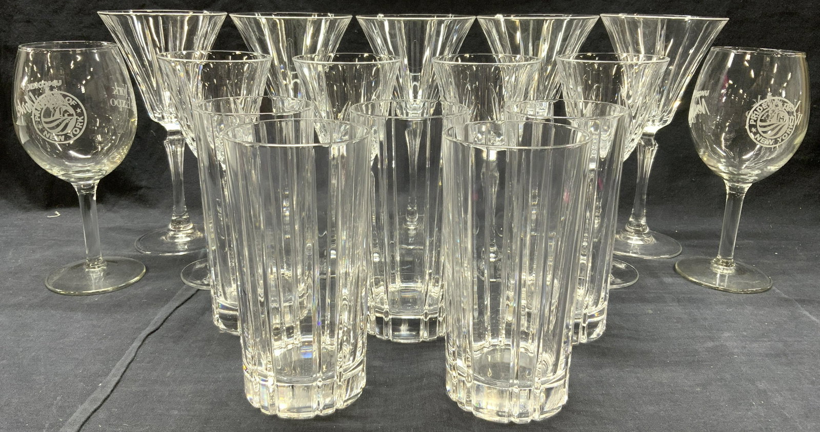 Lot 16 Crystal & Glass Stemware: Lot includes 5 cups, 2 wine glasses, 5 cocktail stemware glasses & 4 stemware goblets. Cocktail stemware measures approx 7.5 inches tall 4 Inches wide. Stemware, crystal stemware, cups, wine glasses, 