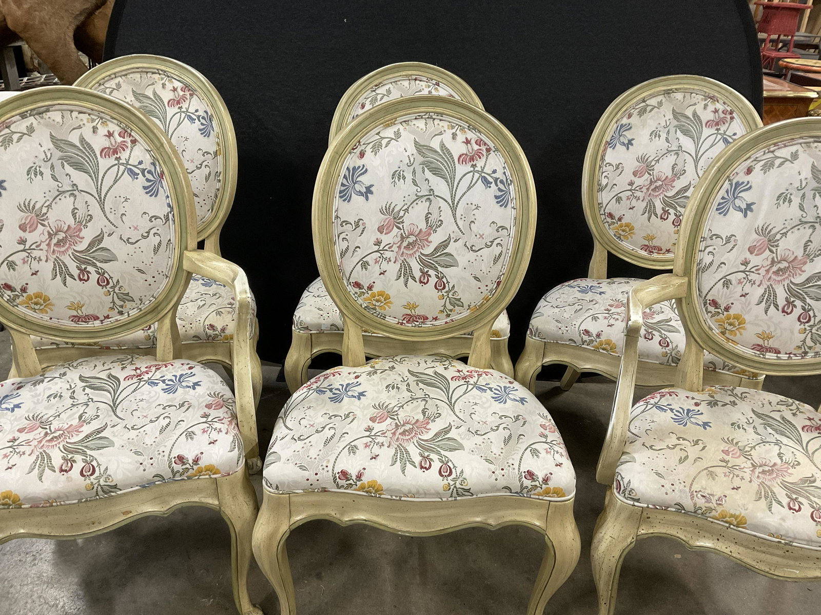 Set 6 Floral Upholstered Dining Chairs: Set 6 Floral Upholstered Dining Chairs. 2 arm chairs, 4 side chairs. Scroll front feet to pieces. Distressed look to painting wood. Measures approx 39H x 22W x 18D Inches. Significant wear to pieces, 