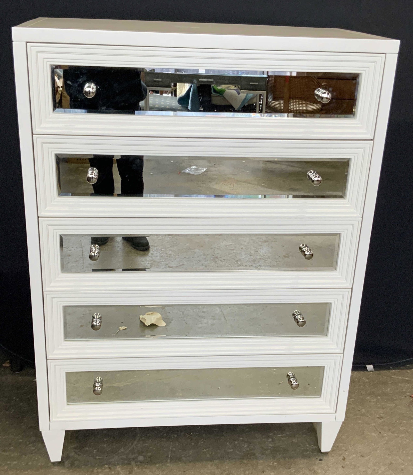 Concerto White 5 Drawer Mirrored Front Dresser: A white Concerto five drawer dresser with a mirrored front. Two drawer pulls to each drawer. Purchased through Mark Hampton LLC. Original price and date: February 11 2014, $989.00. Wobble to piece. So