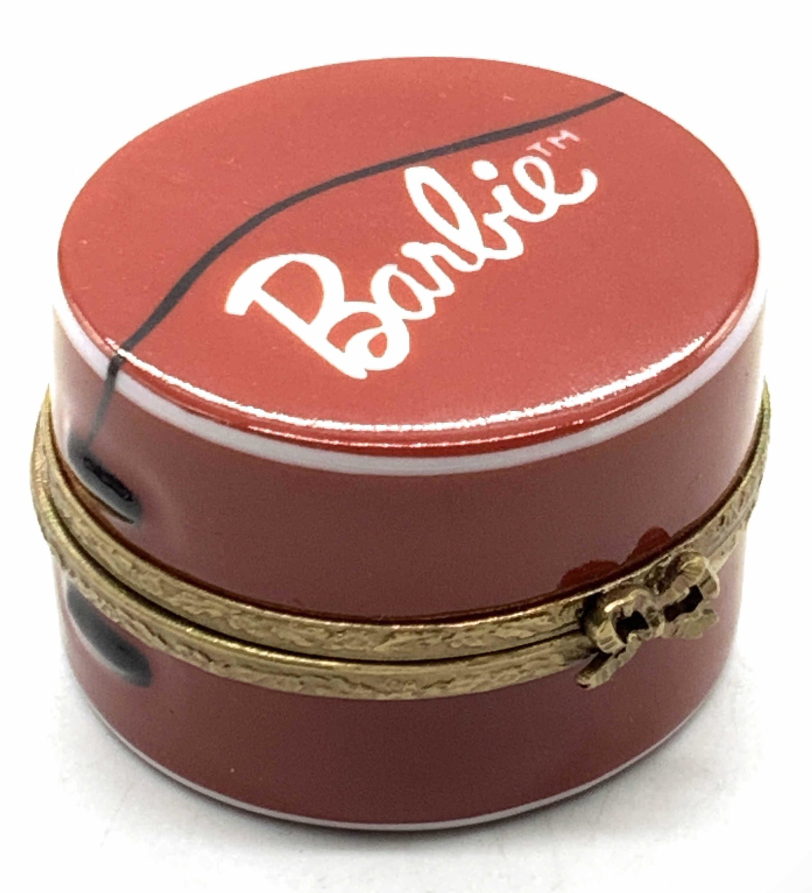 LIMOGES Barbie Porcelain Trinket Box, France: Porcelain trinket box, painted red on exterior with Barbie on the lid. Made to resemble a hat box. Interior is marked Peint Main Rochard Limoges France. Interior to box is white with red hearts and a 