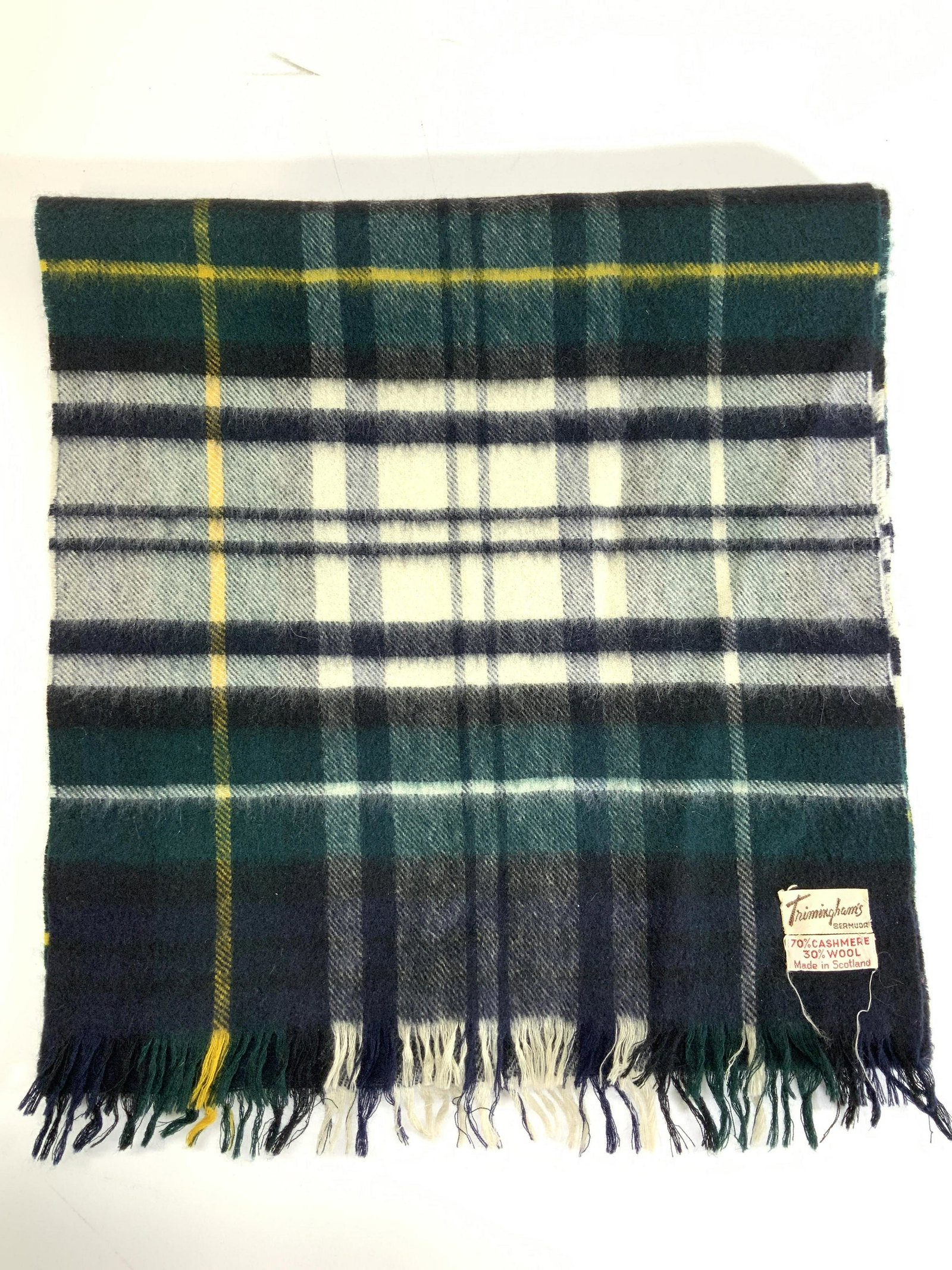 Triminghams Cashmere & Wool Plaid Scarf, Scotland: Green, white , blue and yellow tartan scarf, made in Scotland. 70% cashmere 30% wool. Soft hand. 12 x 50 in. Attached labels on garment Triminghams Tartan Cashmere Wool Scarf, Luxury accessories, wear