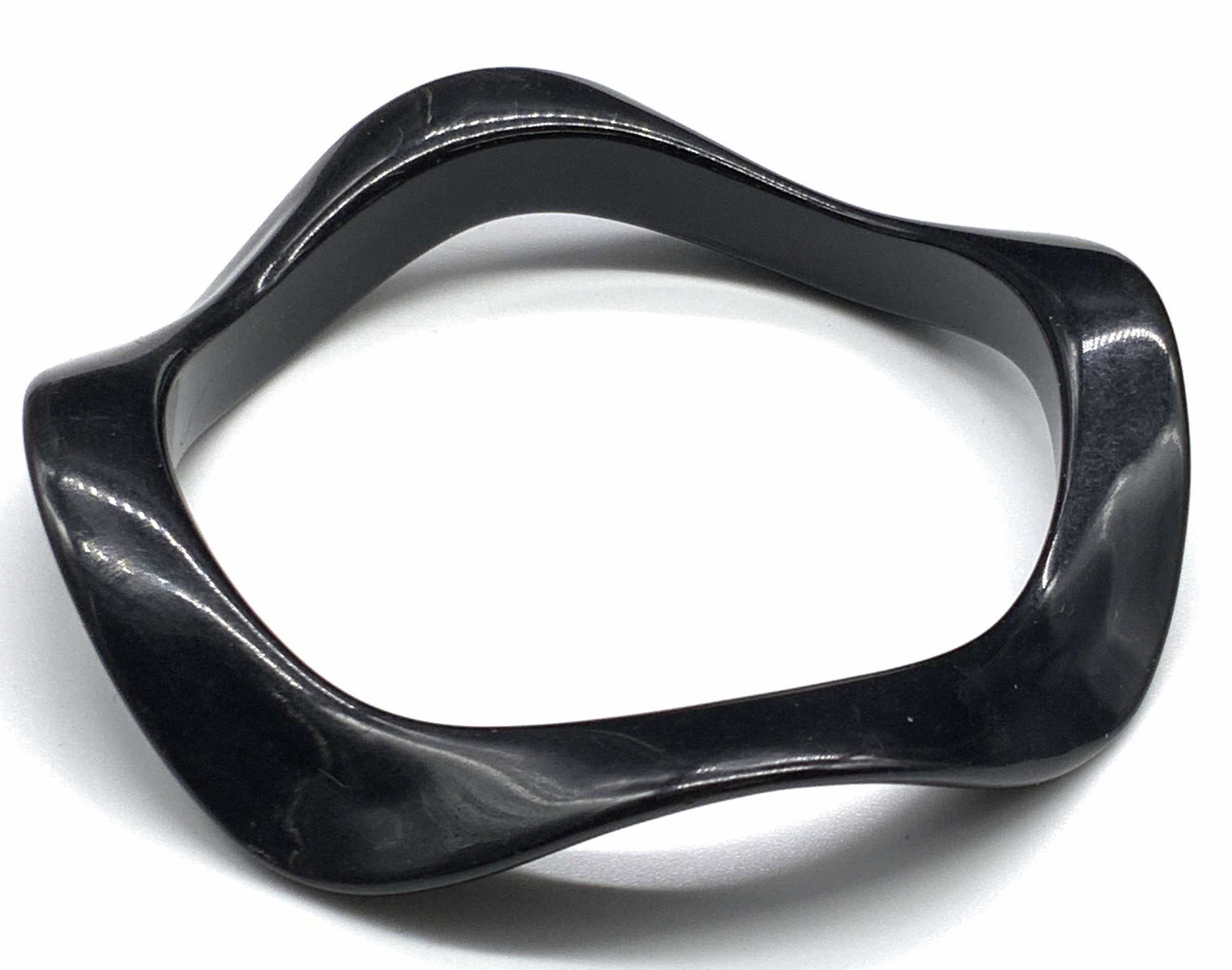 Minimalist Twisted Black Bangle Bracelet, Jewelry: A minimalist style twisted black composite material bangle bracelet. Measures approx 2.5D inches. Some mild surface wear consistent with use. jewelry, accessories, Fashion Jewelry, Estate Jewelry, Cos