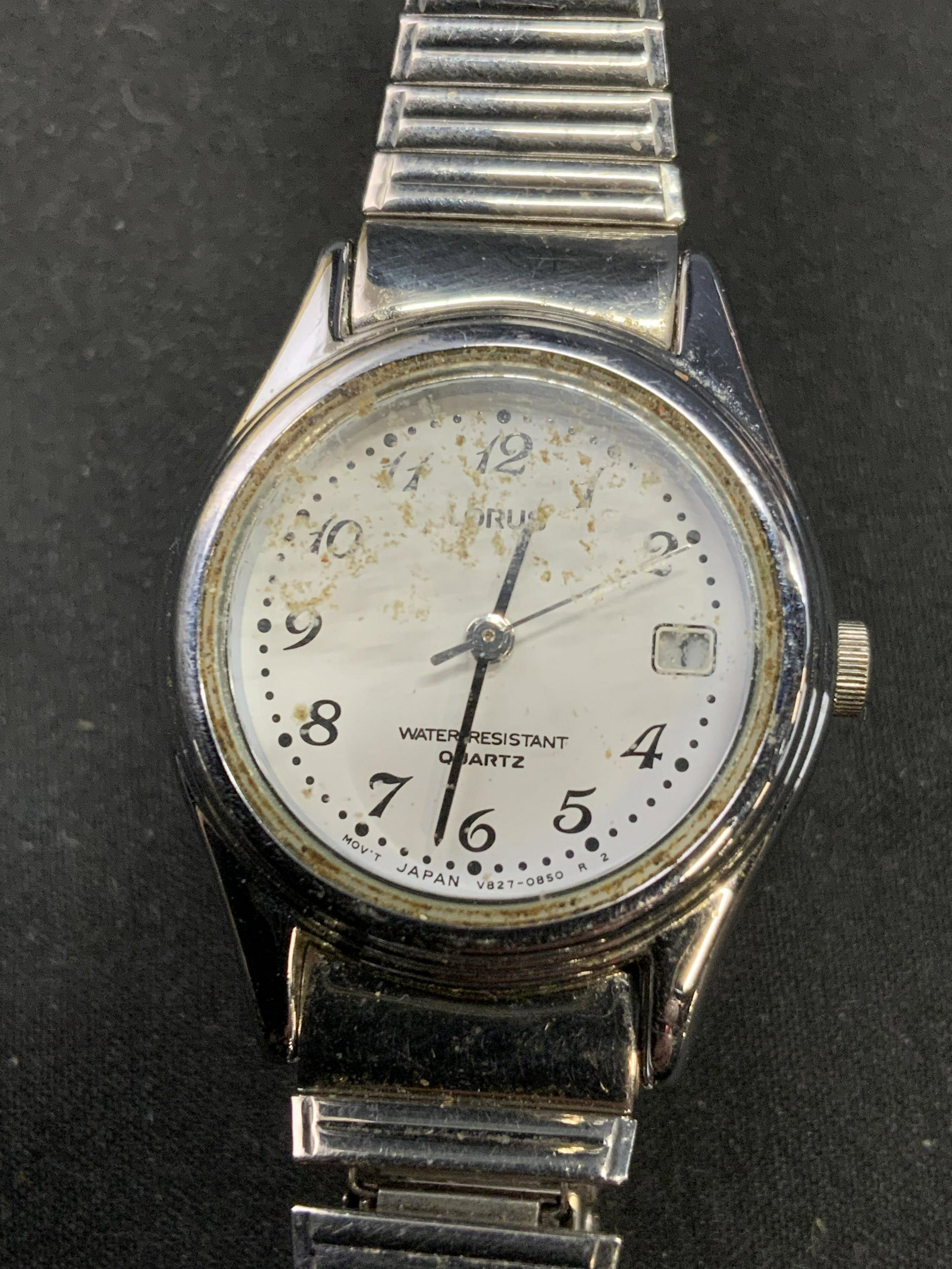 LORUS Stainless Steel Slim Stretch Band Watch: LORUS stainless steel slim stretch band wristwatch. Marked stainless steel, water resistant to underside. Designer label to watch face. Surface wear consistent with exposure. Wrist width approx. 2.5 i