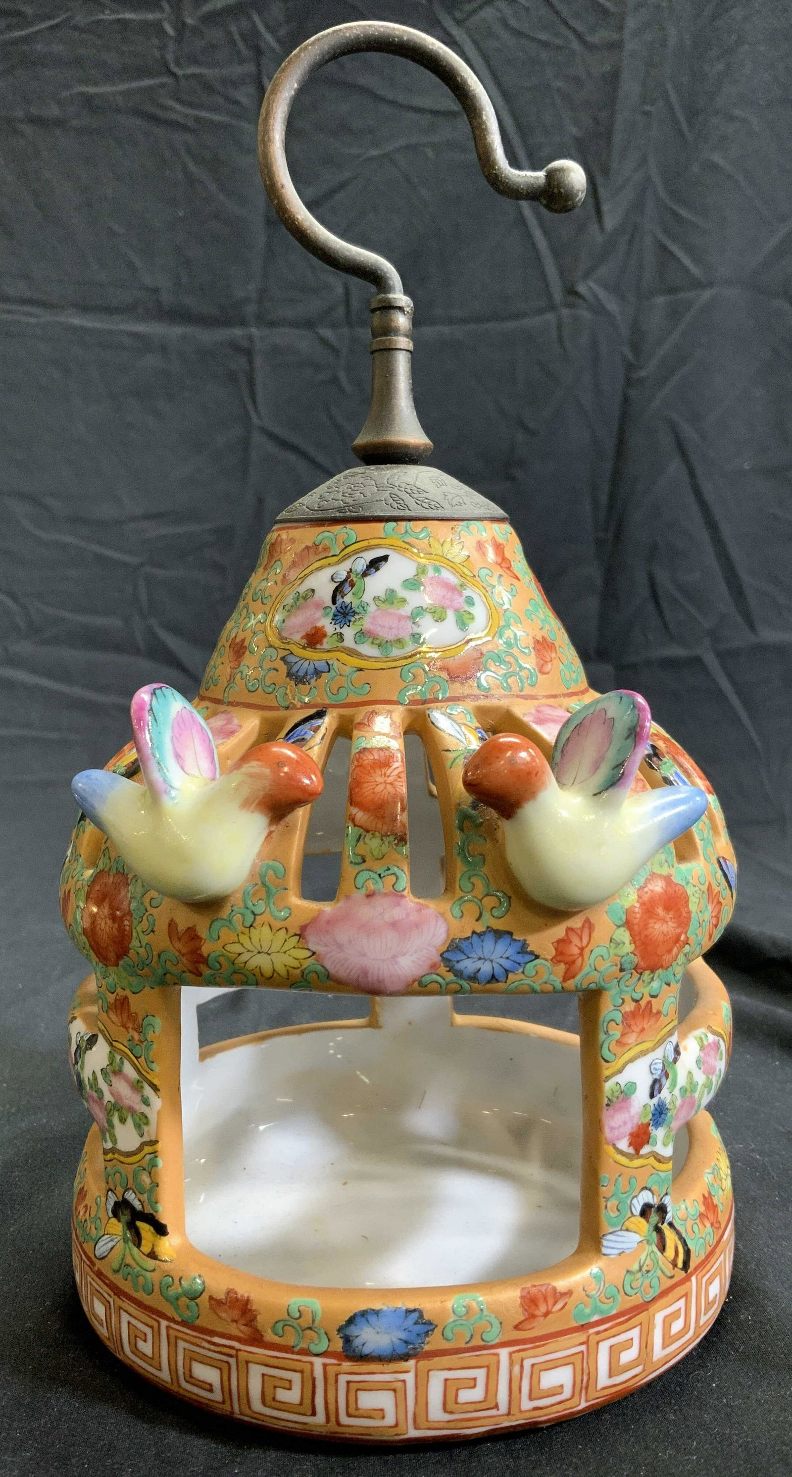 Trademarked H Painted Porcelain Candle Holder: Underside of piece has trademark of male figure portrait with hat and Asian characters. Piece is porcelain and hand painted with intricate floral, vine, leaf, bird & other detail. Top of piece has met