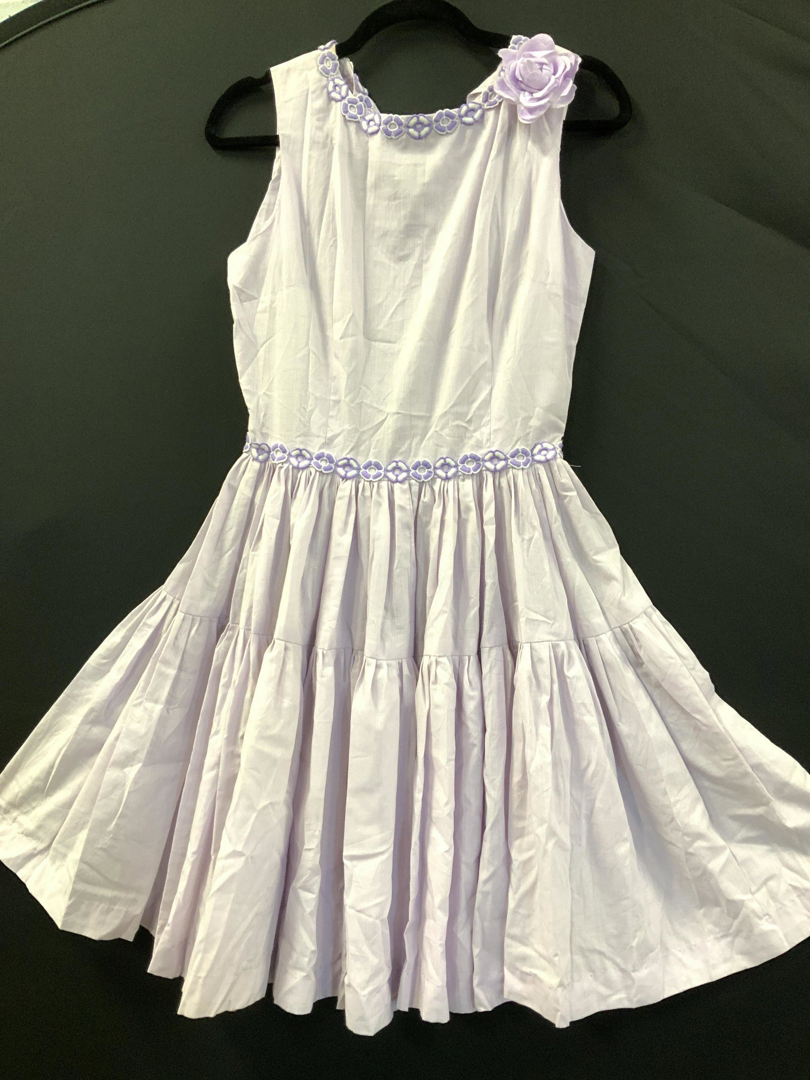 Vintage Violet Cotton Dress w Flower Hems: Cute vintage 60s style cotton sleeveless dress with embroidered flowers along collar and waist with a faux flower brooch on sleeve. 26 in waist. Made by hand by machine . Backside zipper. Summer dress