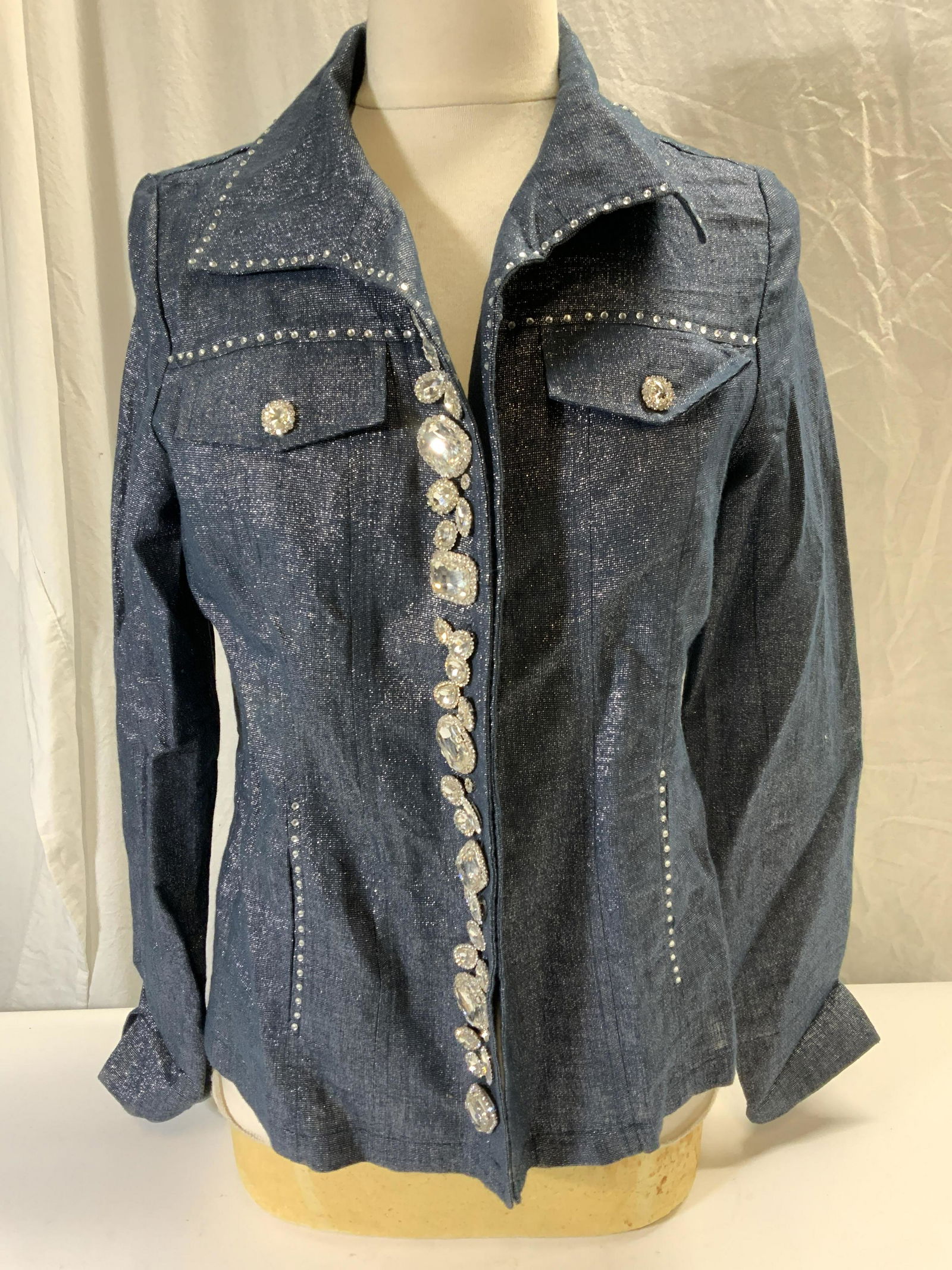 BEREK Blue Linen Blend Bejeweled Jacket: BEREK blue jacket with rhinestone decoration. Buttons to front. Size S. Linen and cotton blend. Gently worn. BEREK, BEREK jacket, ladies designer jacket, ladies linen jacket, ladies designer fashion,