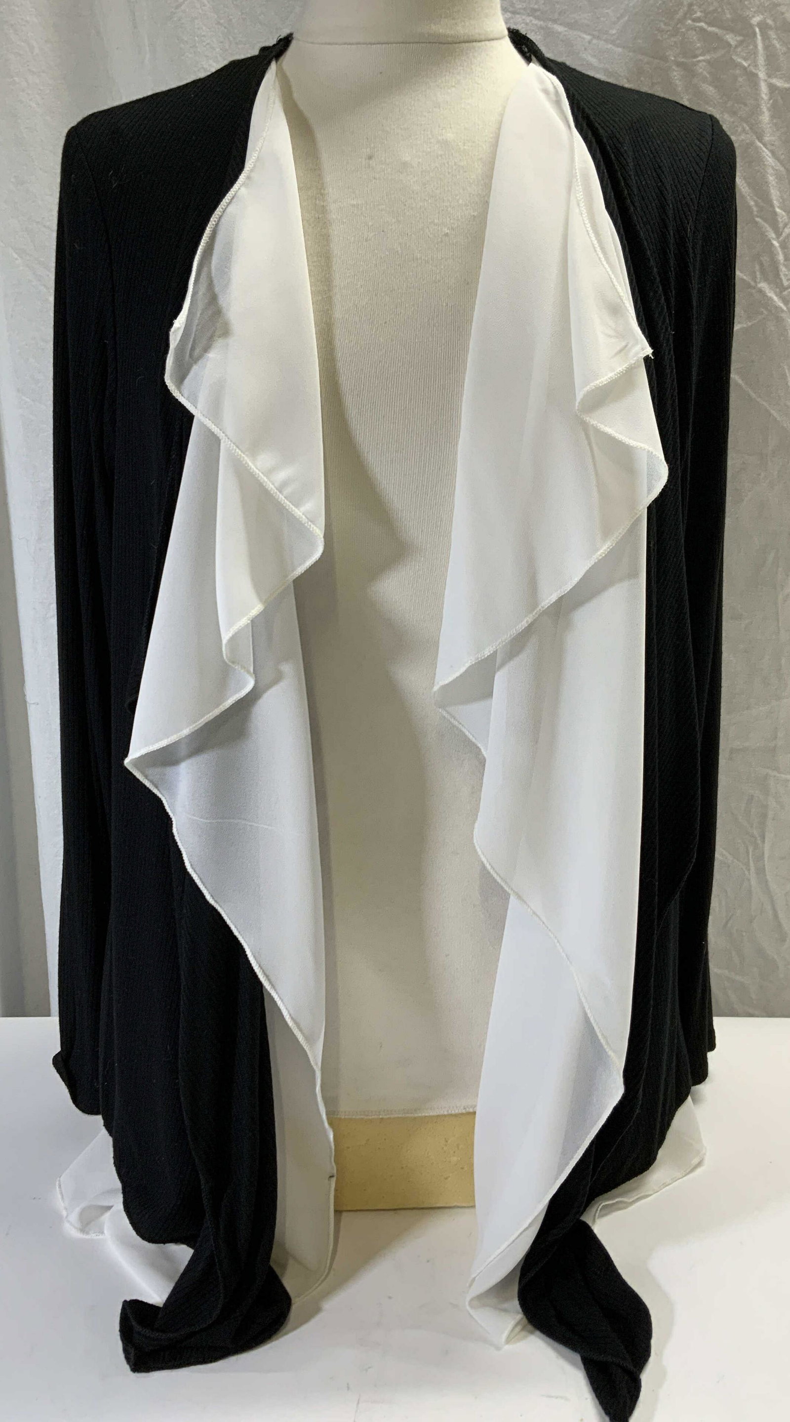 PEBBLE & STONE Black & White Open Cardigan: Pebble and Stone black ribbed cardigan with white trim. Size XL. Body rayon and spandex. Trim 100% polyester. Gently worn. Pebble and stone, pebble and stone cardigan, ladies designer cardigan, ladies