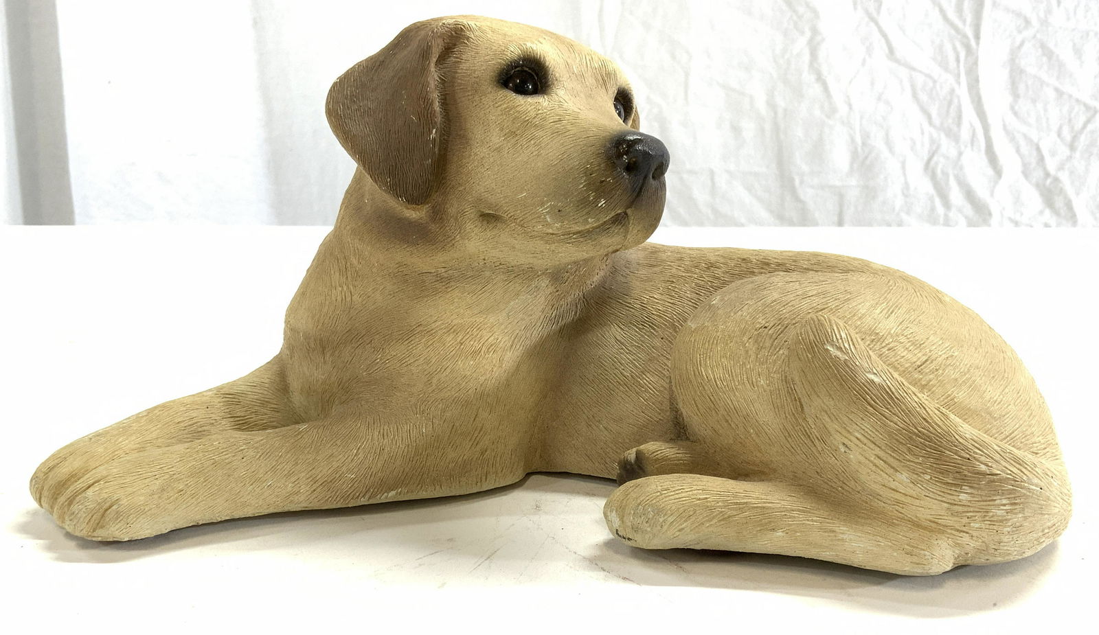 SANDRA BRUE Signed SANDICAST Labrador Dog C 1984: Underside is signed SANDRA BRUE. Dog sculpture is SANDICAST depicts a laying Labrador with head turned. Piece measures approx 10 inches long 6 inches wide 5 inches tall. Vintage dog figure, SANDICAST