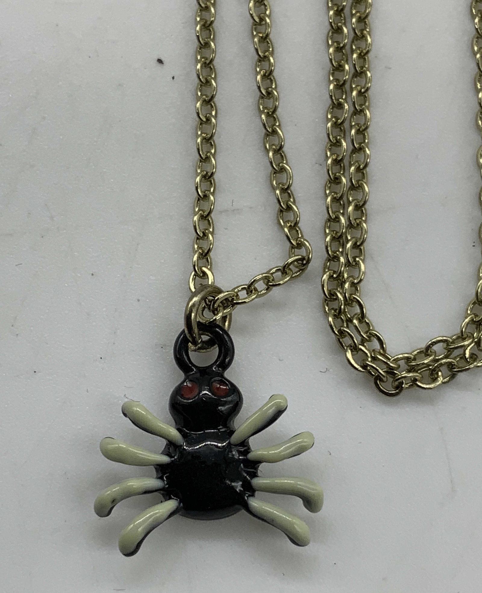 Spider Pendant Choker Necklace, Jewelry: Spider pendant choker necklace. Enamel on metal. Measures approx. 15.75 inches long. Some wear to surface consistent with exposure. Choker necklace, spider necklace, spider pendant, pendant necklace, 