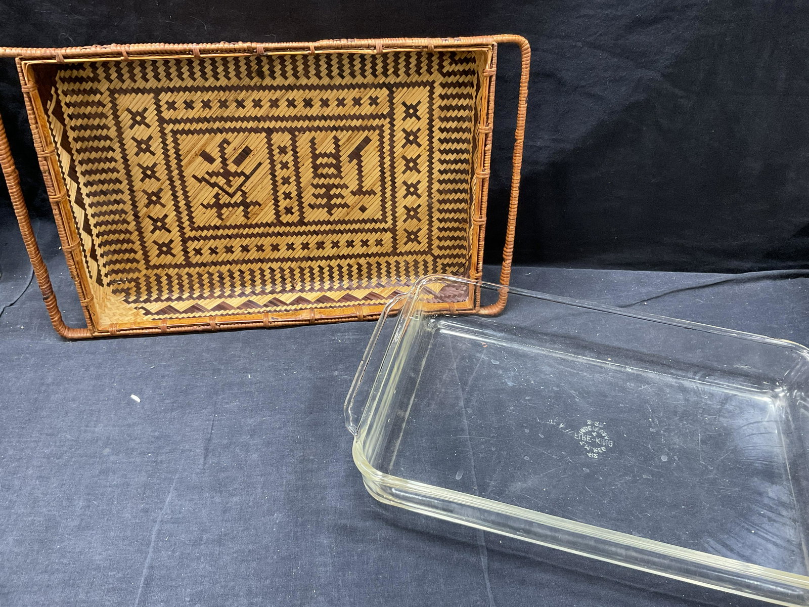 Lot 2 Kitchen Baking Tray & Woven Basket , USA: Lot 2 Kitchen Baking Tray & Woven Basket. Largest piece measures 17 x 14 inches. Surface wear to both pieces consistent with age and use. Glass tray reads Fire- King, made in USA 3 Qt. Woven basket ha