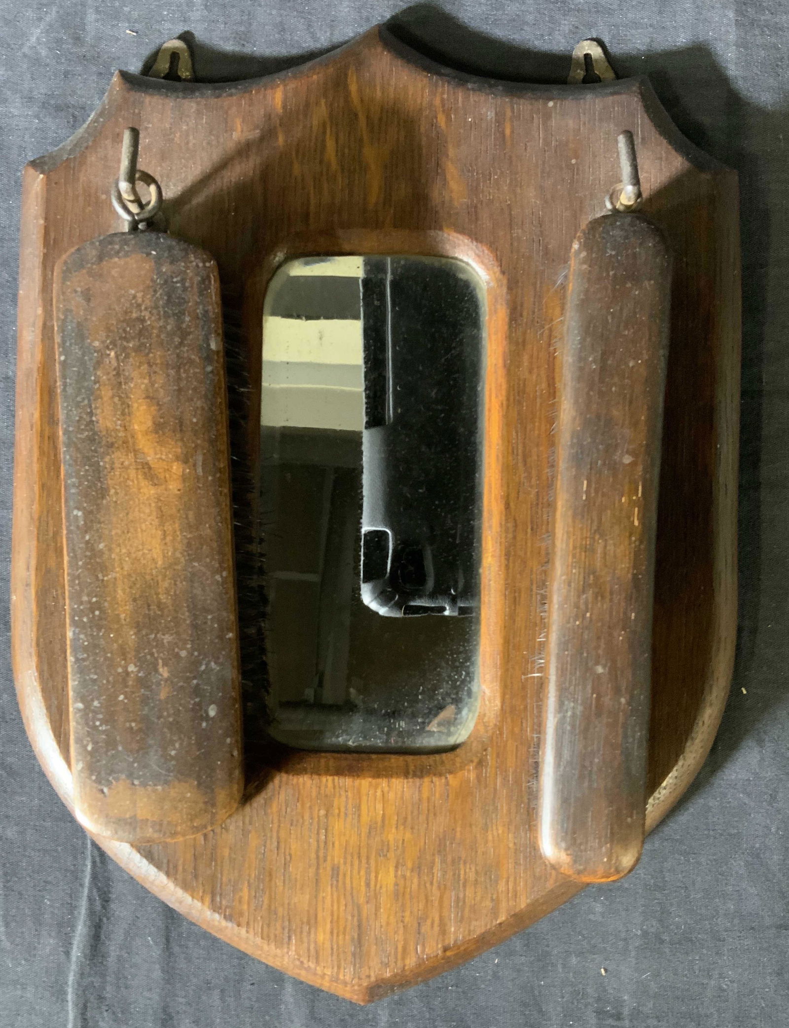 Vintage Hall Mirror with Clothes Brushes: Vintage Hall Mirror with Clothes Brushes, no apparent inscriptions or marks, measures 12 1/4 x 9 inches, larger brush measures 6 5/8 x 1 3/4 inches, smaller brush measures 7 1/4 x 1 1/8 inches, surfac