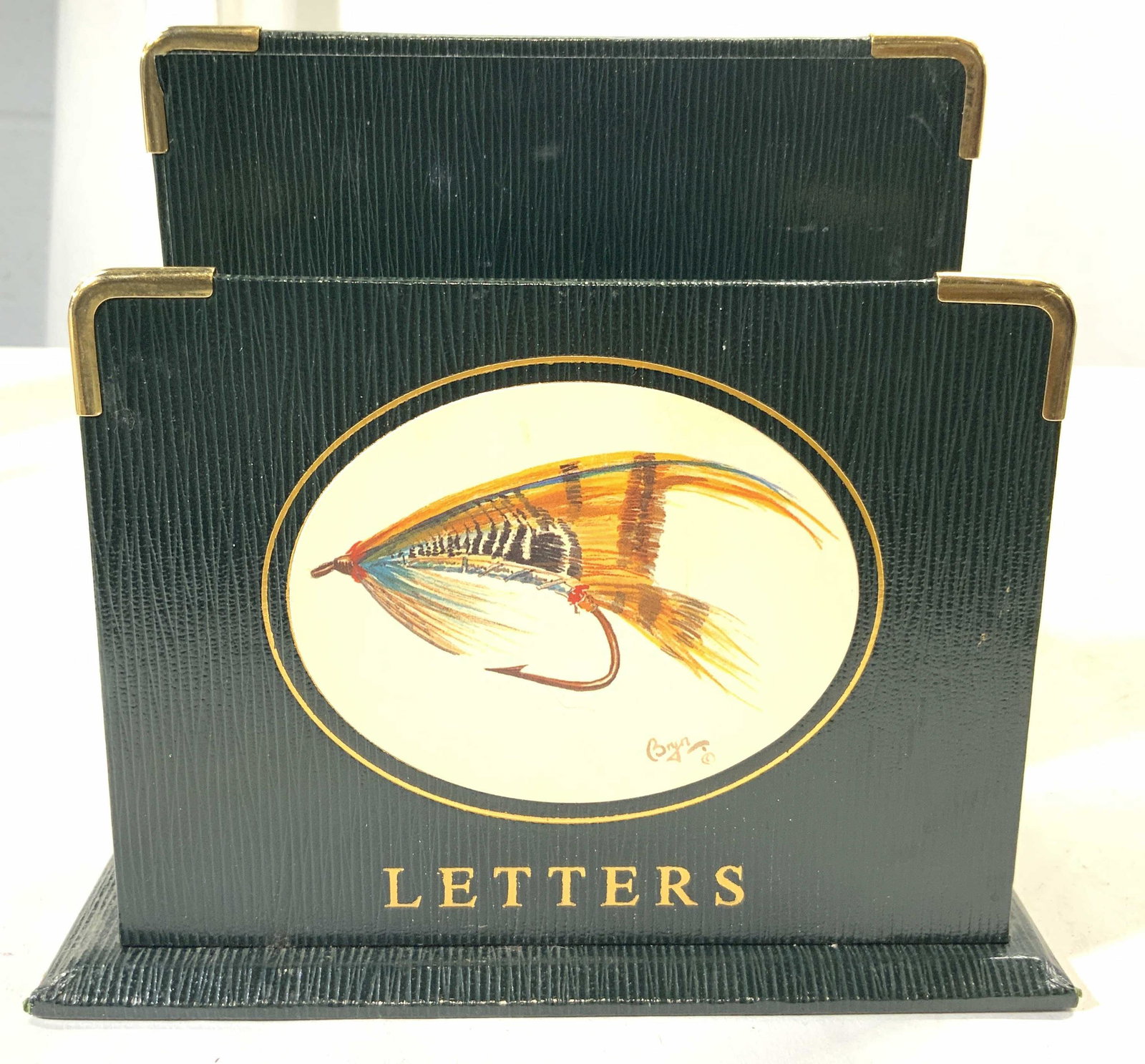 BRYN PARRY Handmade Leather Lined Letter Holder: Underside has tag which reads BRYN PARRY HAND MADE ENGLAND. Piece appears to possibly be lined in Leather. Piece has image of fishing lure on front. Piece measures approx 6.25 inches tall 7 inches wid